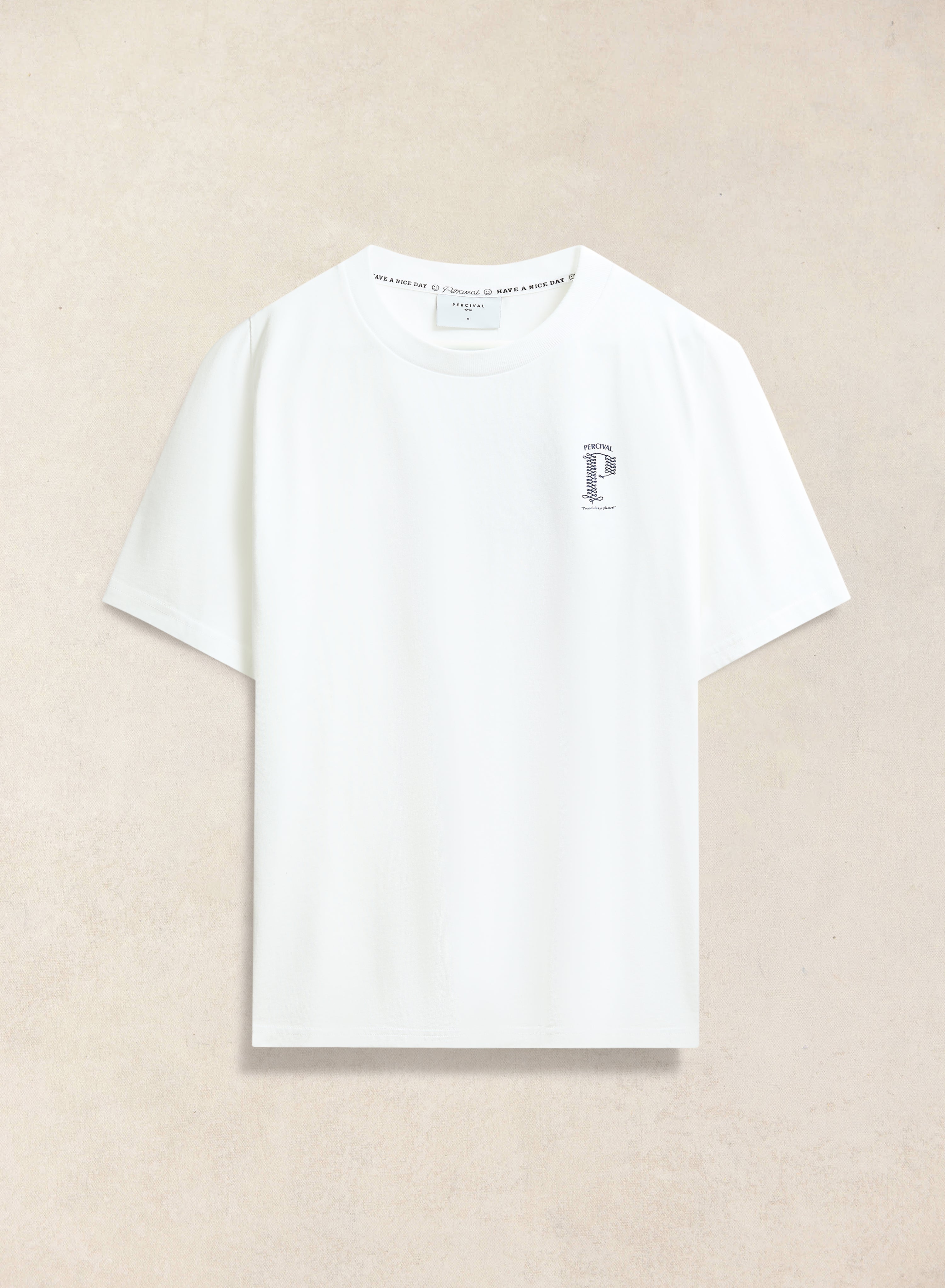 The white Cyril T-shirt from Percival, laid flat to show the small chest graphic and collar detail.