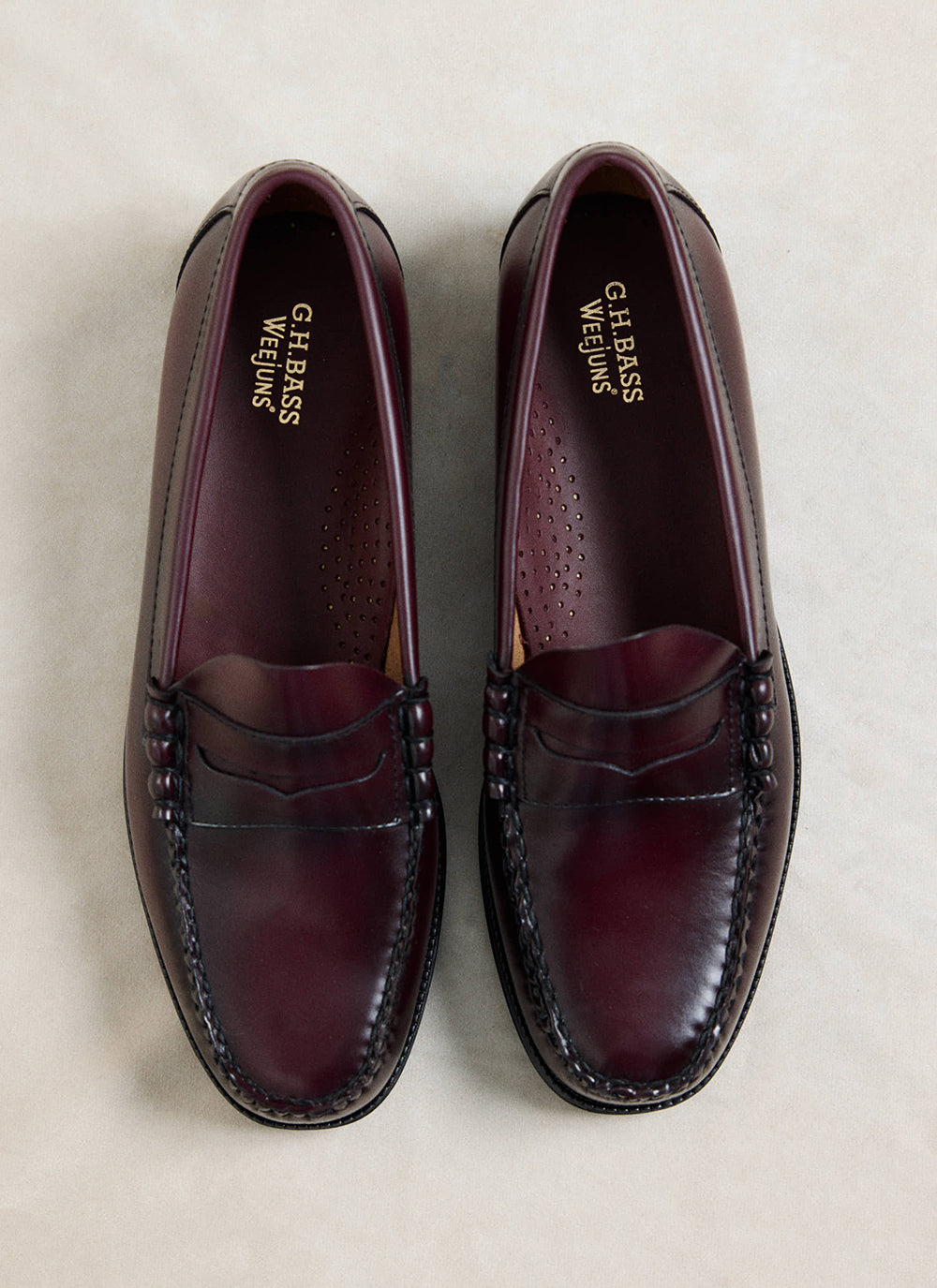 G.H.Bass Easy Weejun Larson Flag Penny Loafers in polished wine leather, viewed from above showing gold footbed branding.
