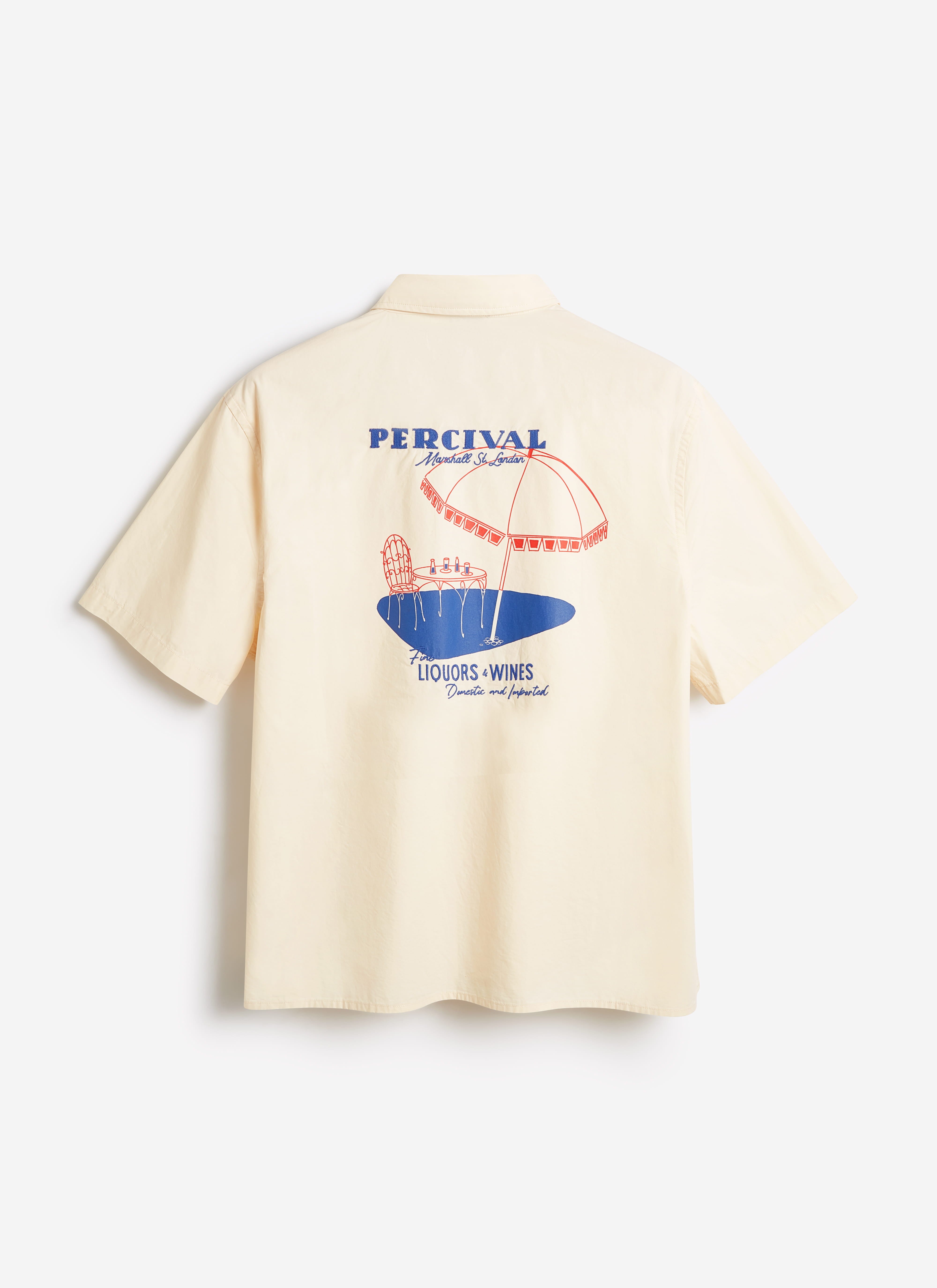 Back view of the Percival Harlow Boxy Shirt in ecru cotton, featuring a large red and blue embroidered beach scene.