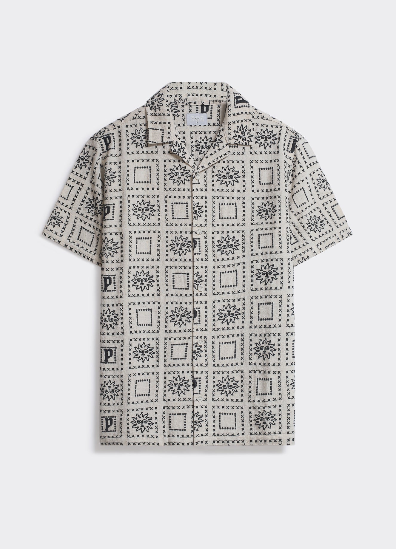 Percival Heaton Shirt in cream and black, a short-sleeved shirt with a tiled sun motif and Cuban collar, shown flat.
