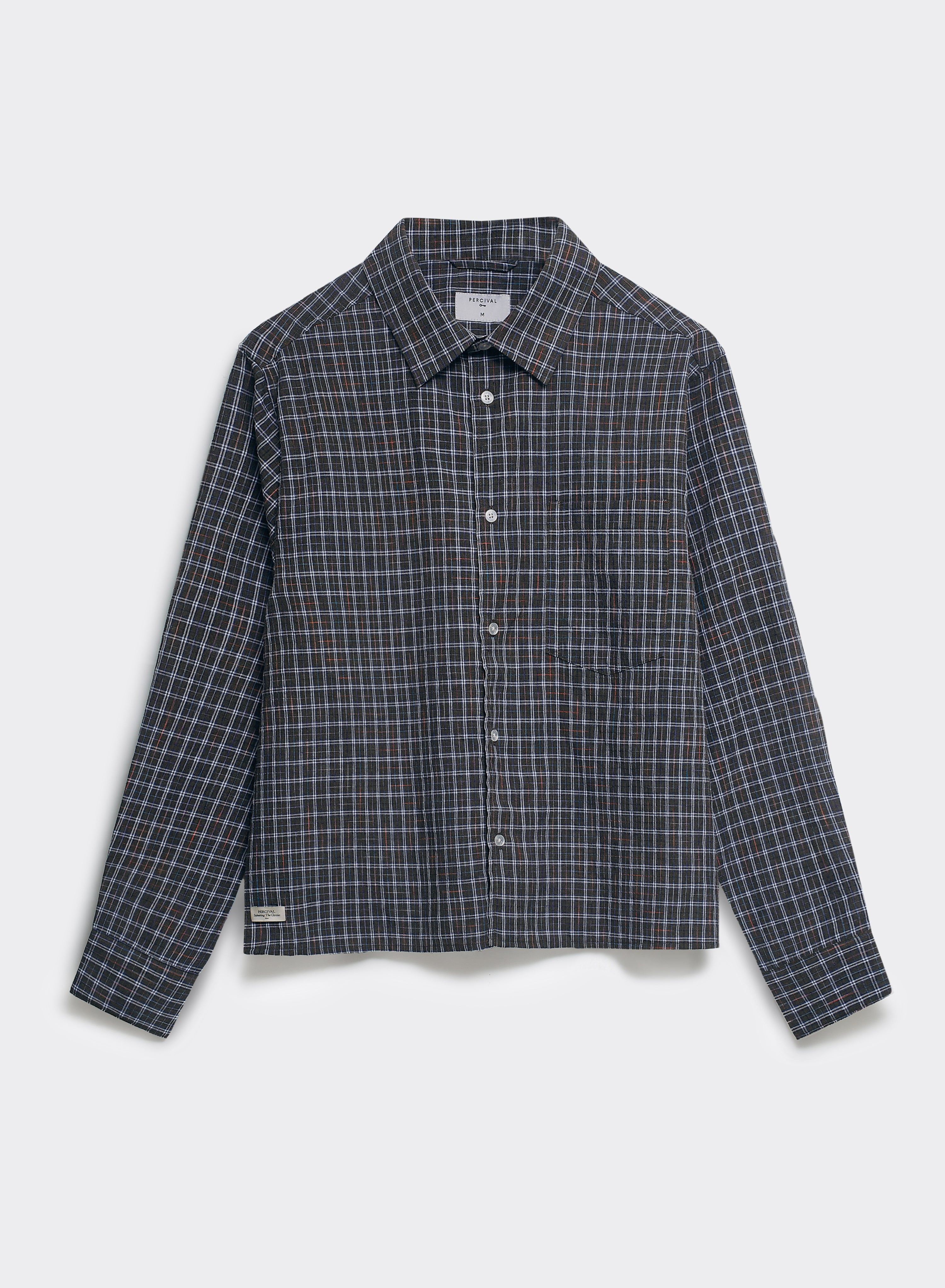 The Percival Hinsley brown checked boxy shirt, made from 100% cotton with a point collar and white buttons, shown flat.