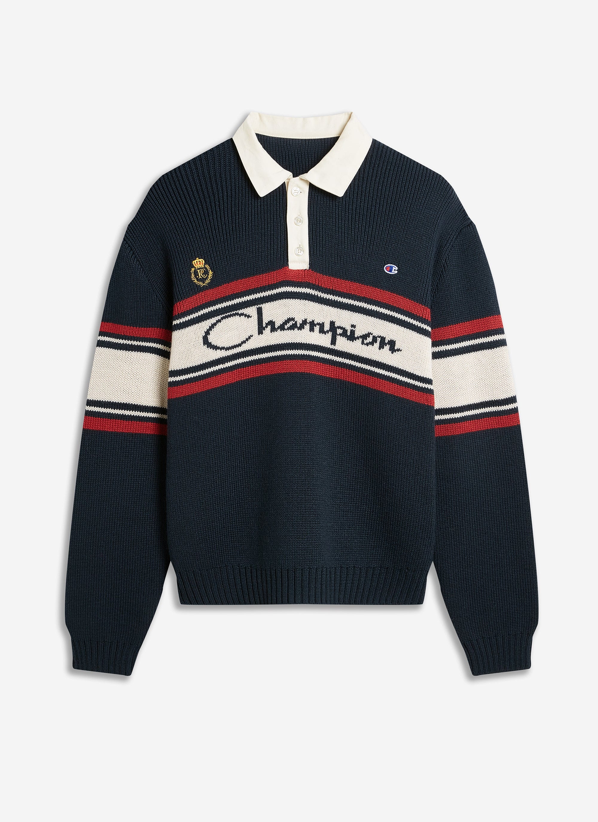 The Champion x Percival Jacquard Knitted Rugby Shirt in navy, shot flat to show its contrast collar and striped branding.