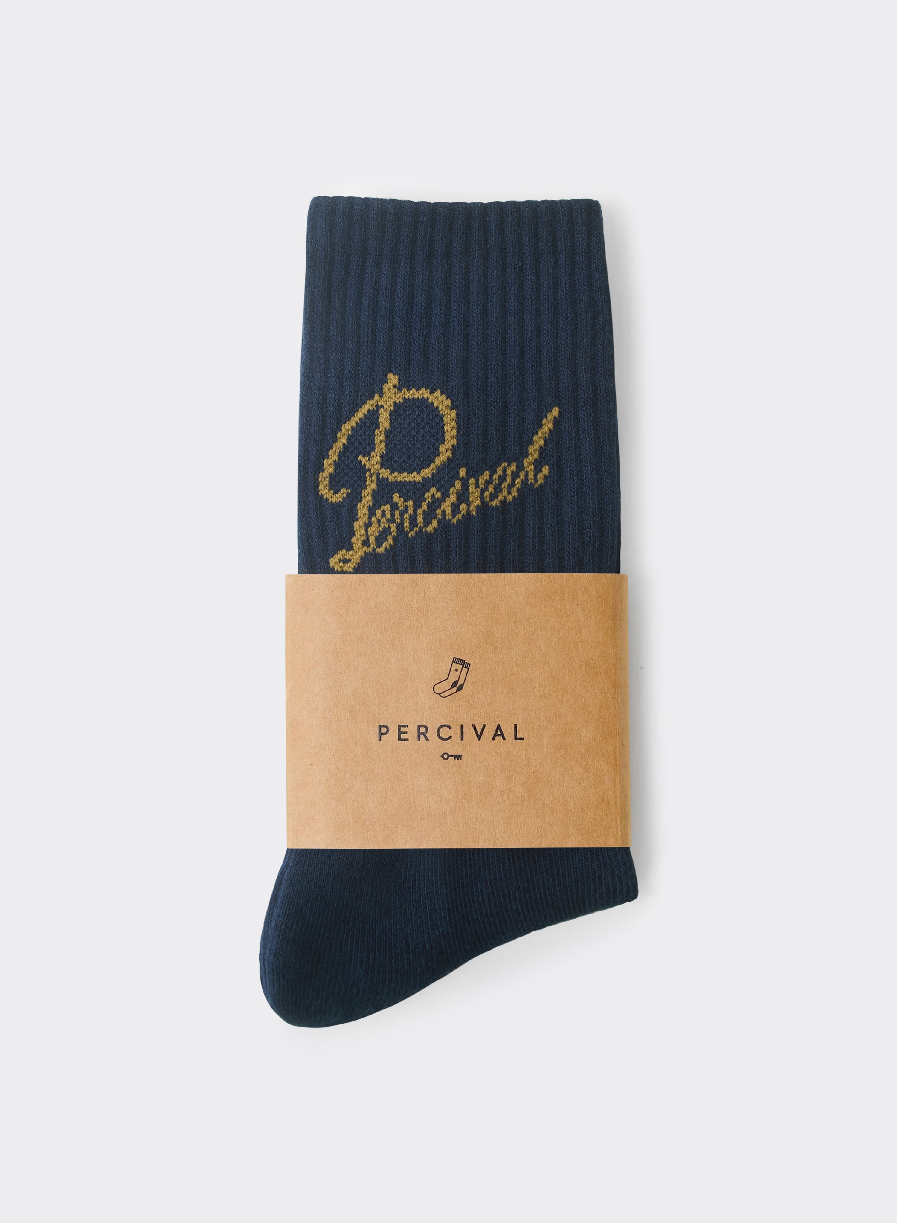 Navy Percival Kingsley Jacquard Socks with a gold script logo and ribbed cotton-blend knit, shown in paper packaging.
