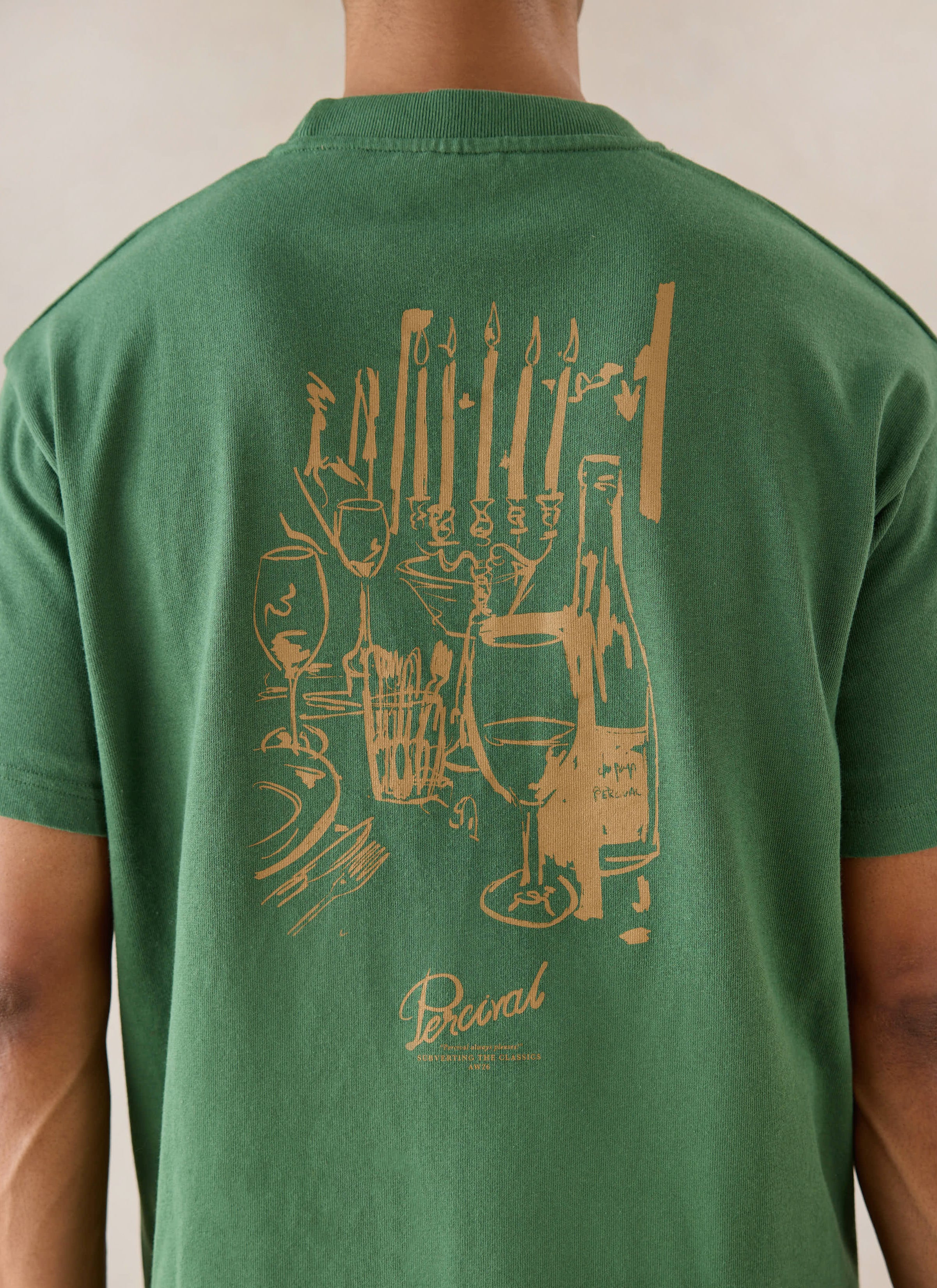 Forest green Percival Marley oversized T-shirt, featuring a dinner party back graphic, shown from behind on a model.
