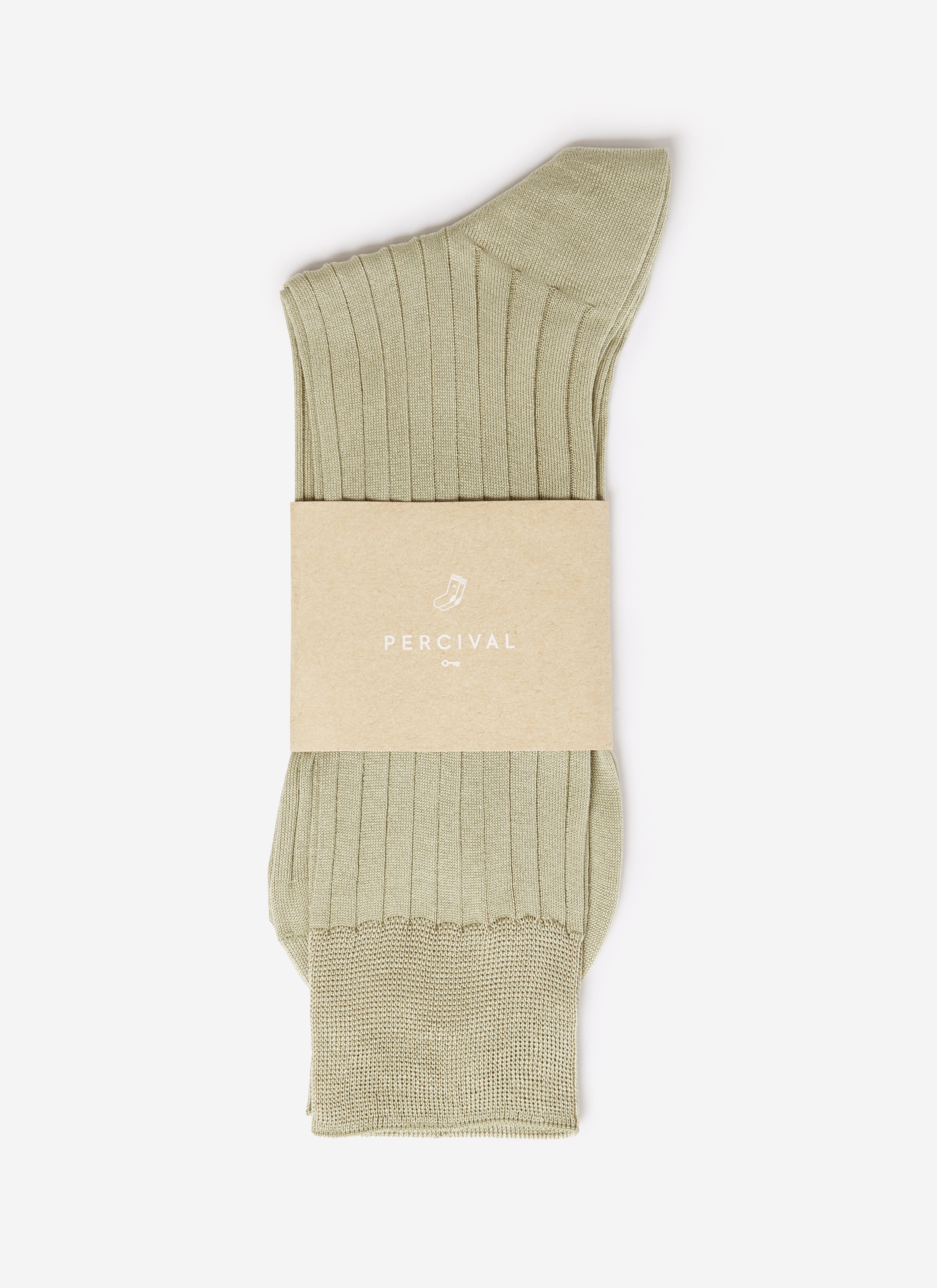 A pair of sage green ribbed cotton Percival Loafer Dress Socks, shown folded with branded paper packaging.