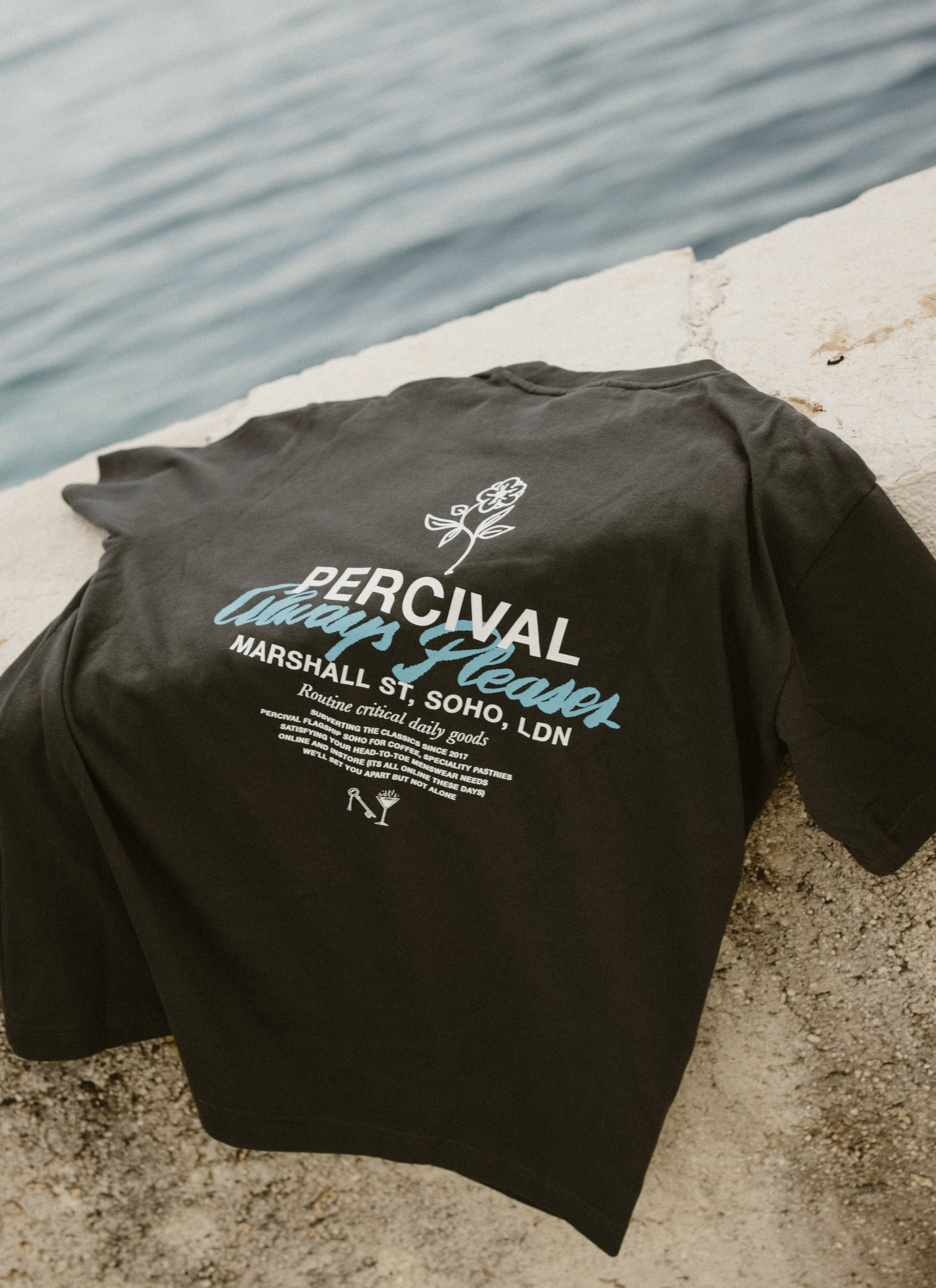Back of the charcoal Percival Otto Oversized T-shirt in organic cotton, featuring a bold white and blue graphic print.