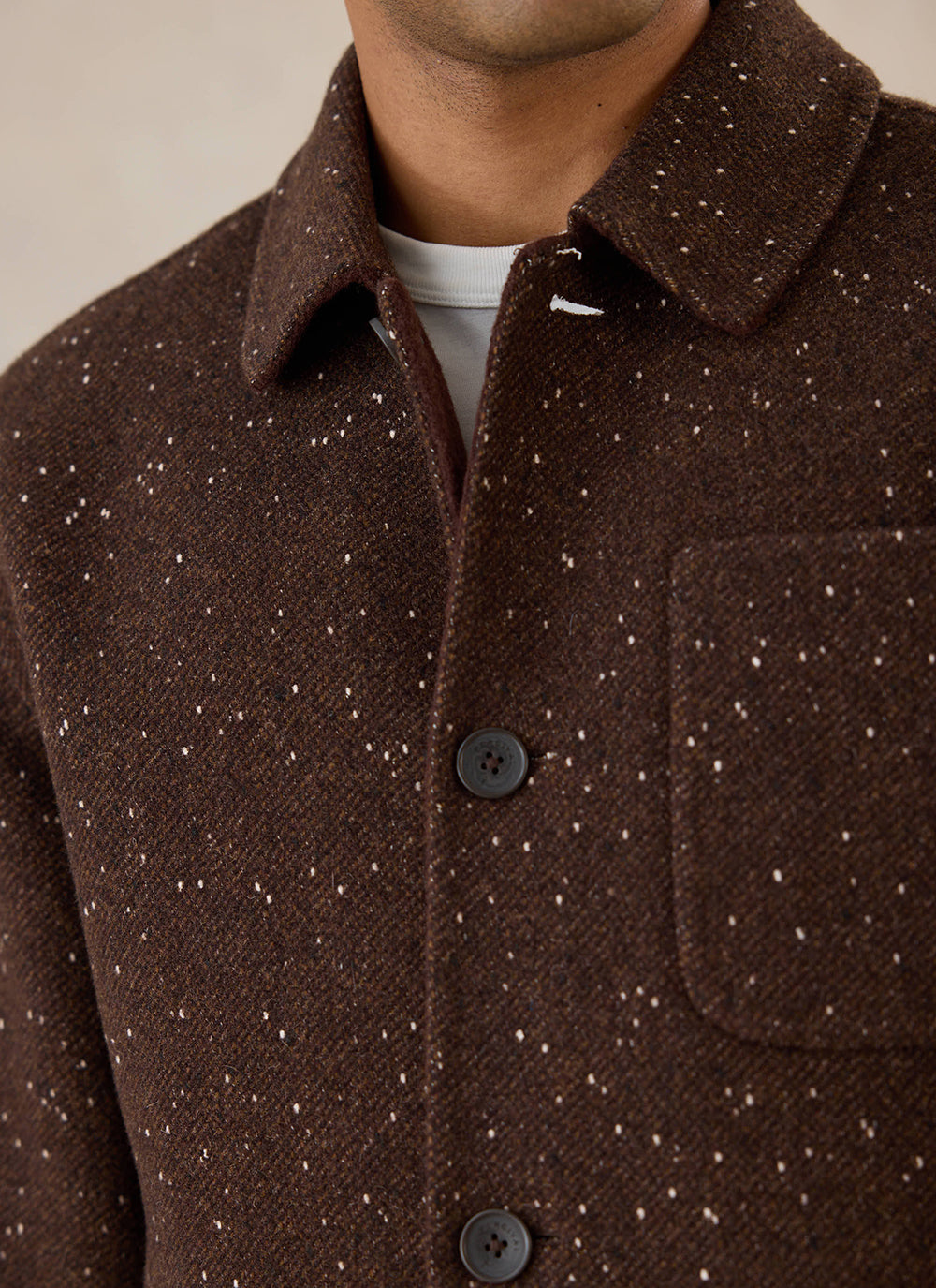 Close-up of the brown fleck double-faced wool overshirt from Percival, highlighting the textured fabric and buttons.