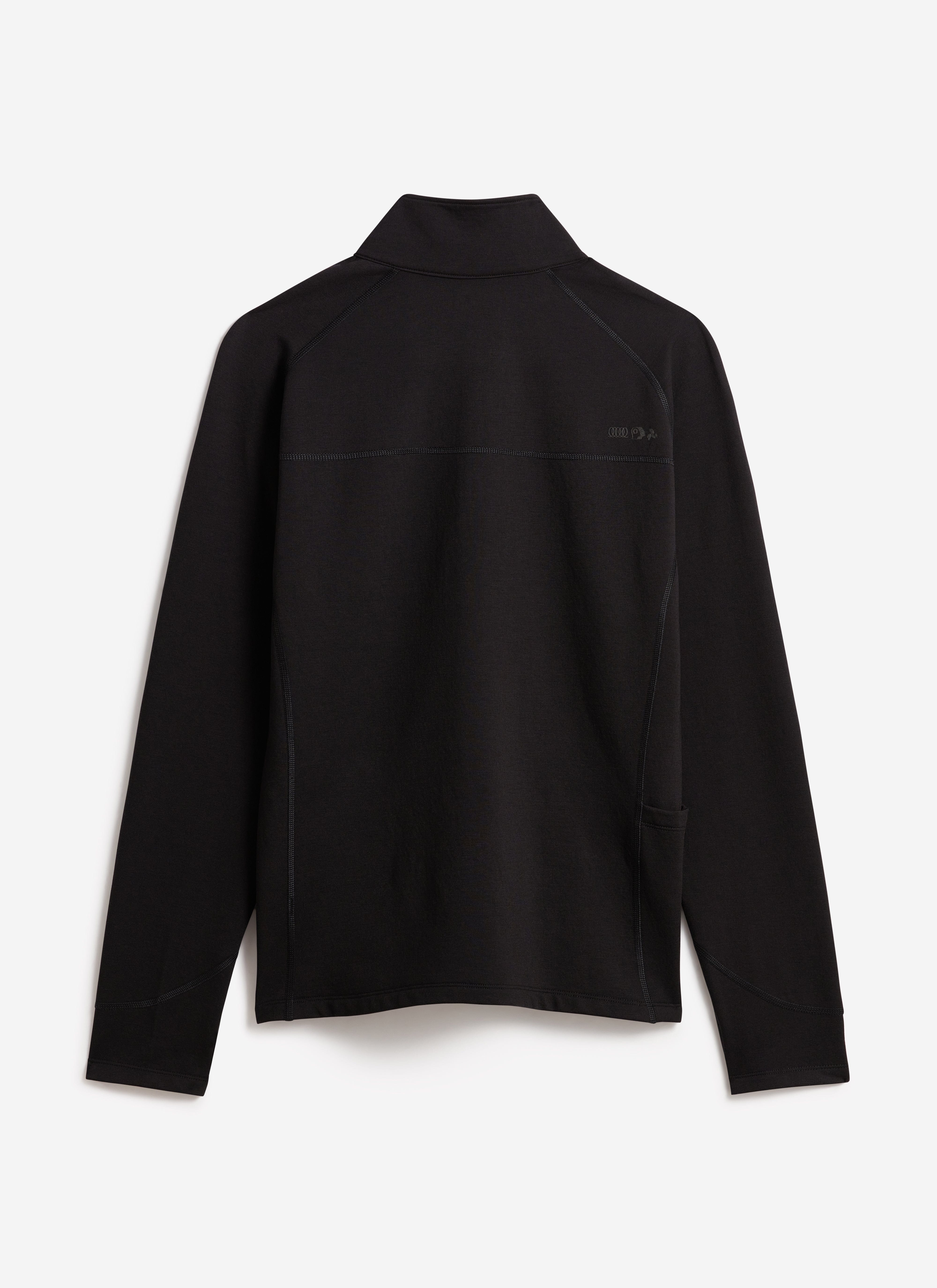 The black PCVL Base Layer Quarter Zip Jacket by Percival, laid flat to show the back view, raglan sleeves and stash pocket.