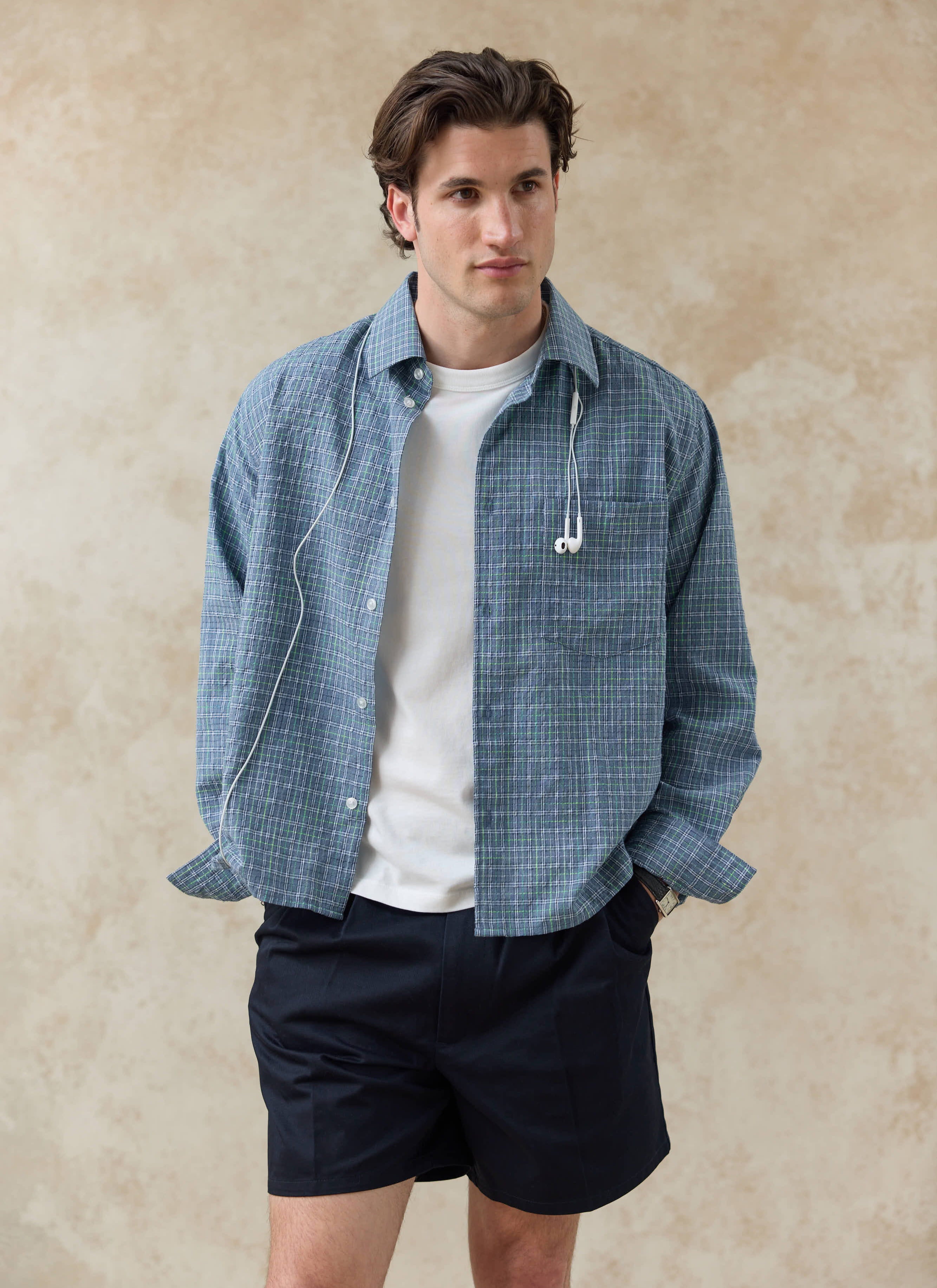 Percival Hinsley Checked Boxy Shirt in blue cotton with green grid lines, layered over a white t-shirt.