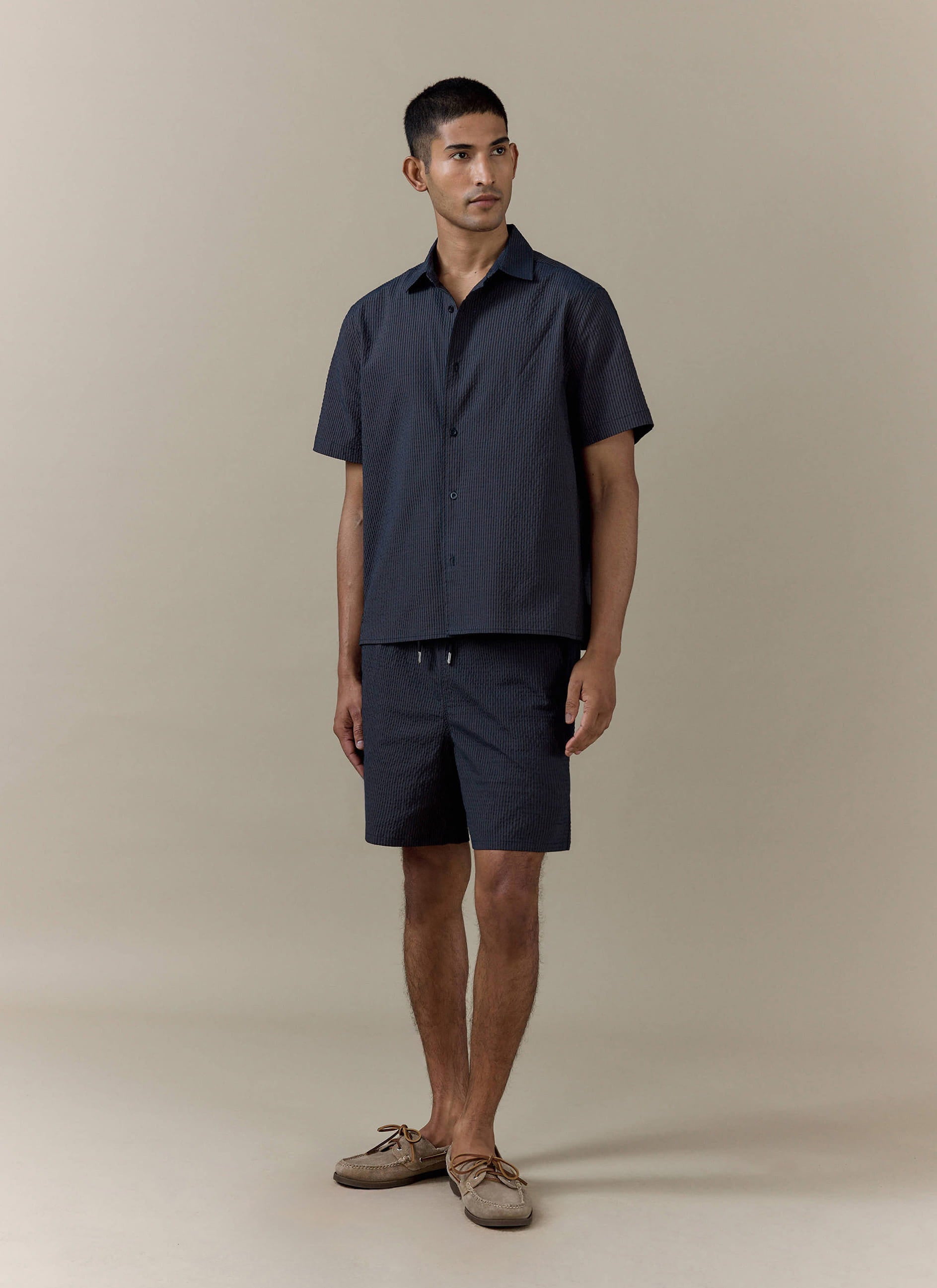 Navy stripe Rowan Seersucker Boxy Shirt by Percival, crafted from cotton and styled with matching shorts.