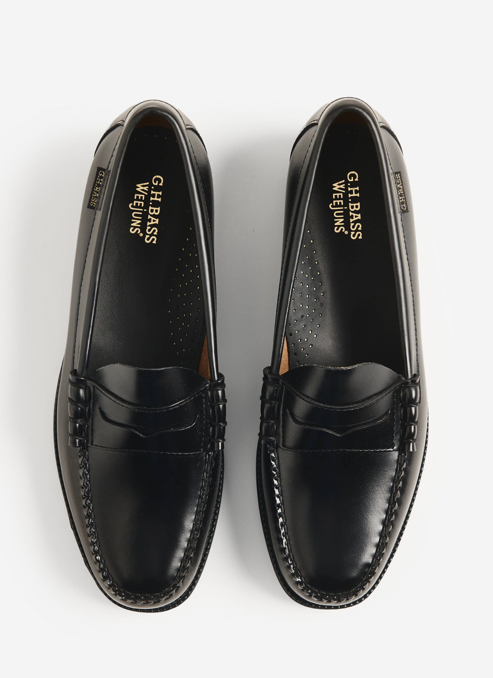 An overhead shot of the G.H. Bass Weejuns Larson Flag loafers in black polished leather, from Percival.