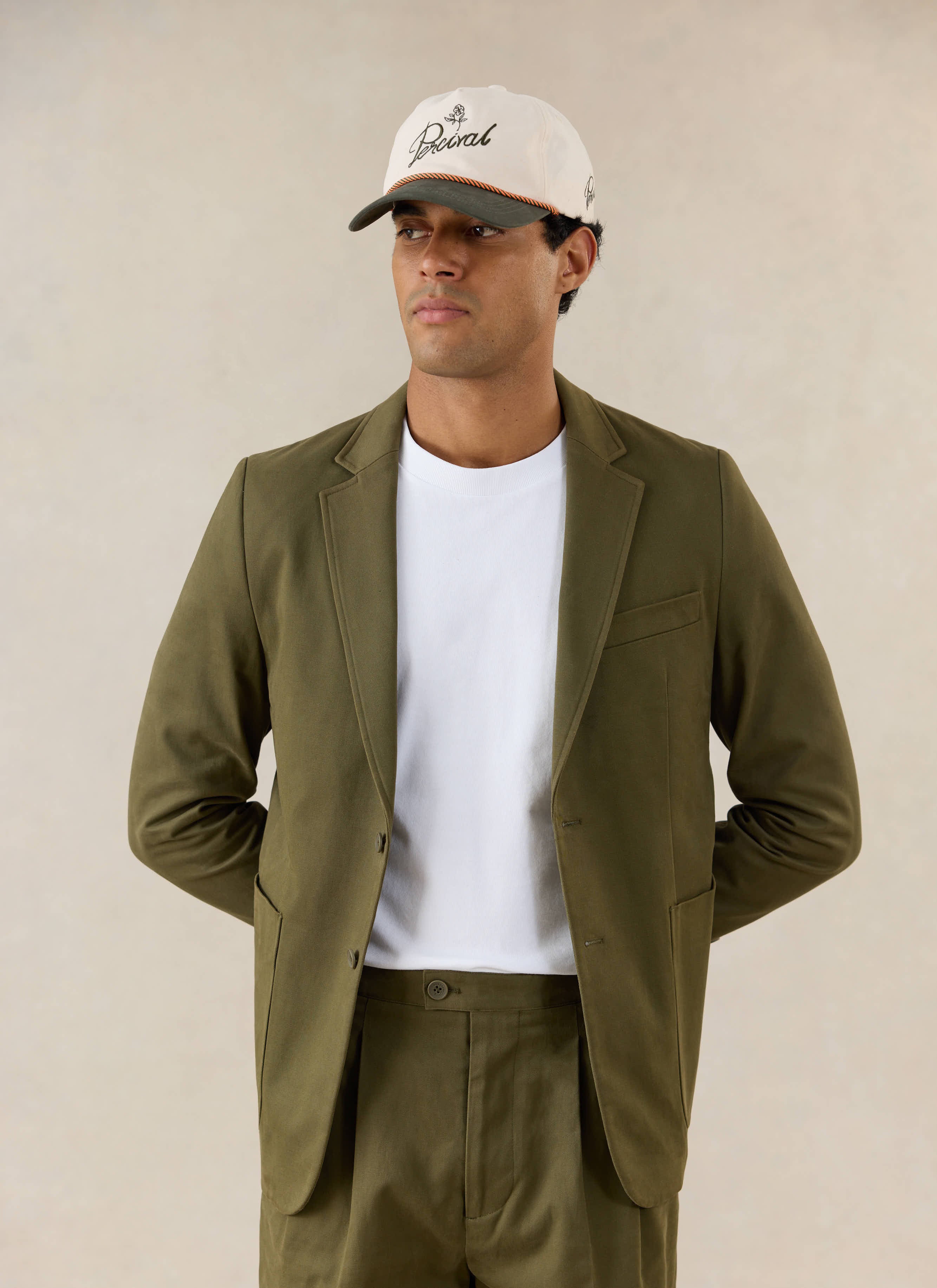 A model wears the Percival Blake Tailored Blazer in Forest Brushed Moleskin.