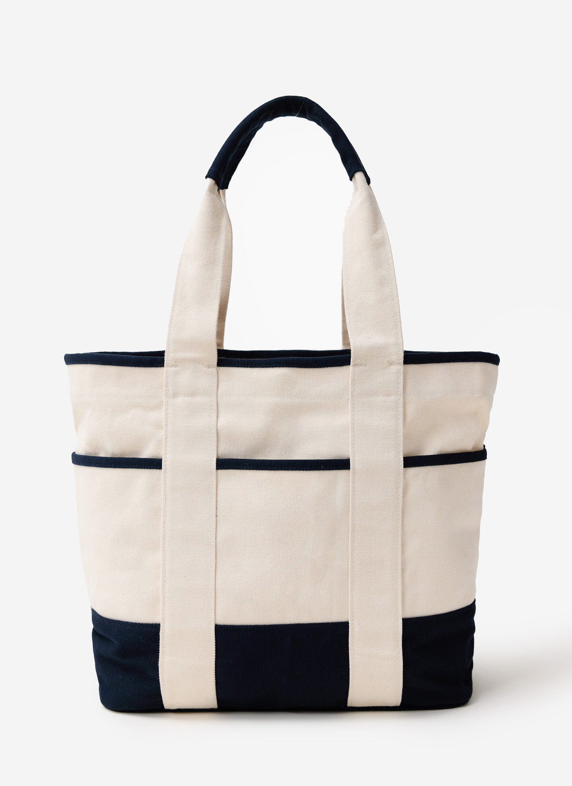 The Percival Tote Bag in ecru and navy cotton canvas, photographed against a white studio background.