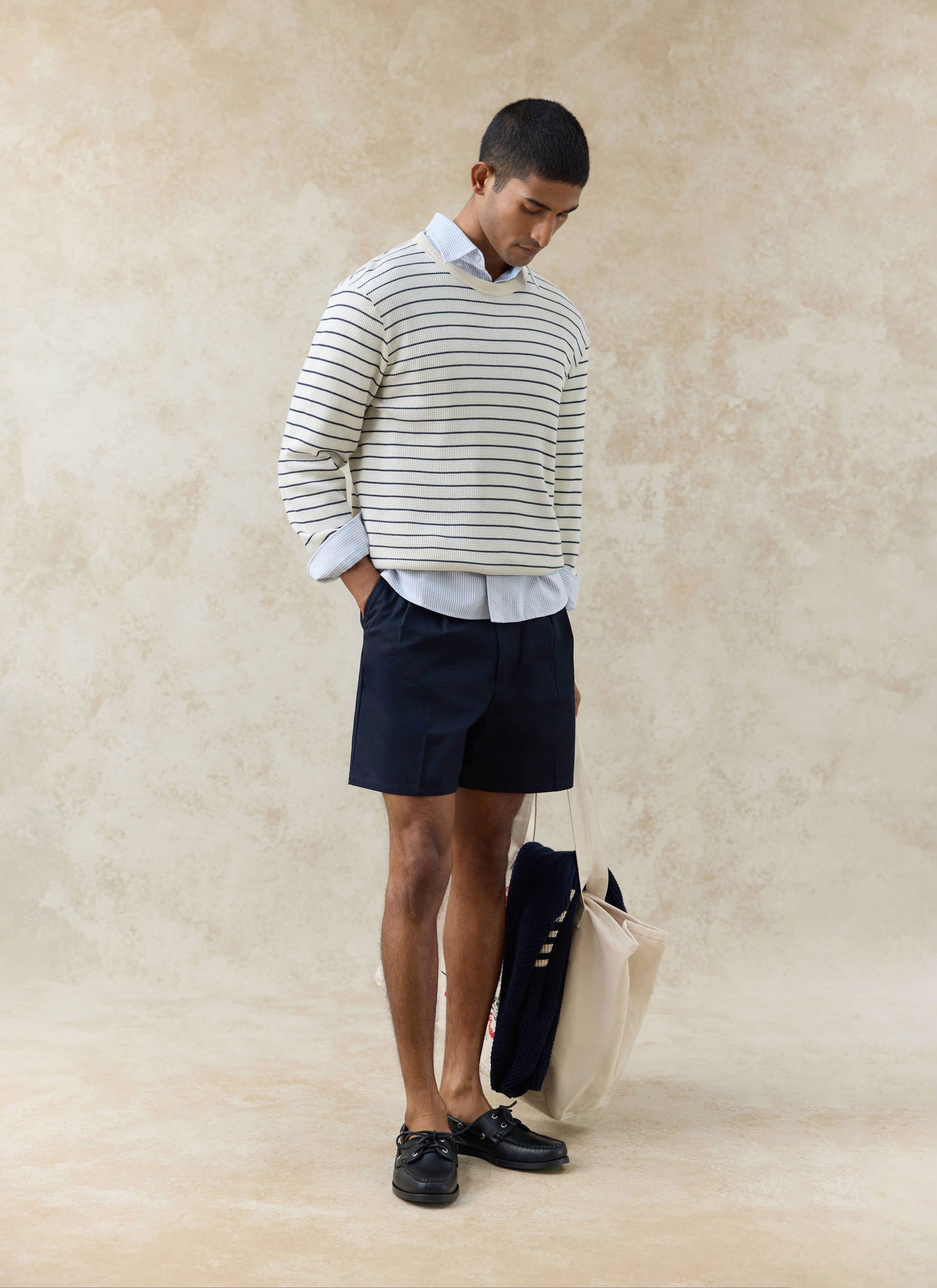 Percival Ernie Waffle Long Sleeve T Shirt in cream stripe organic cotton, styled with navy shorts and a cream tote bag.