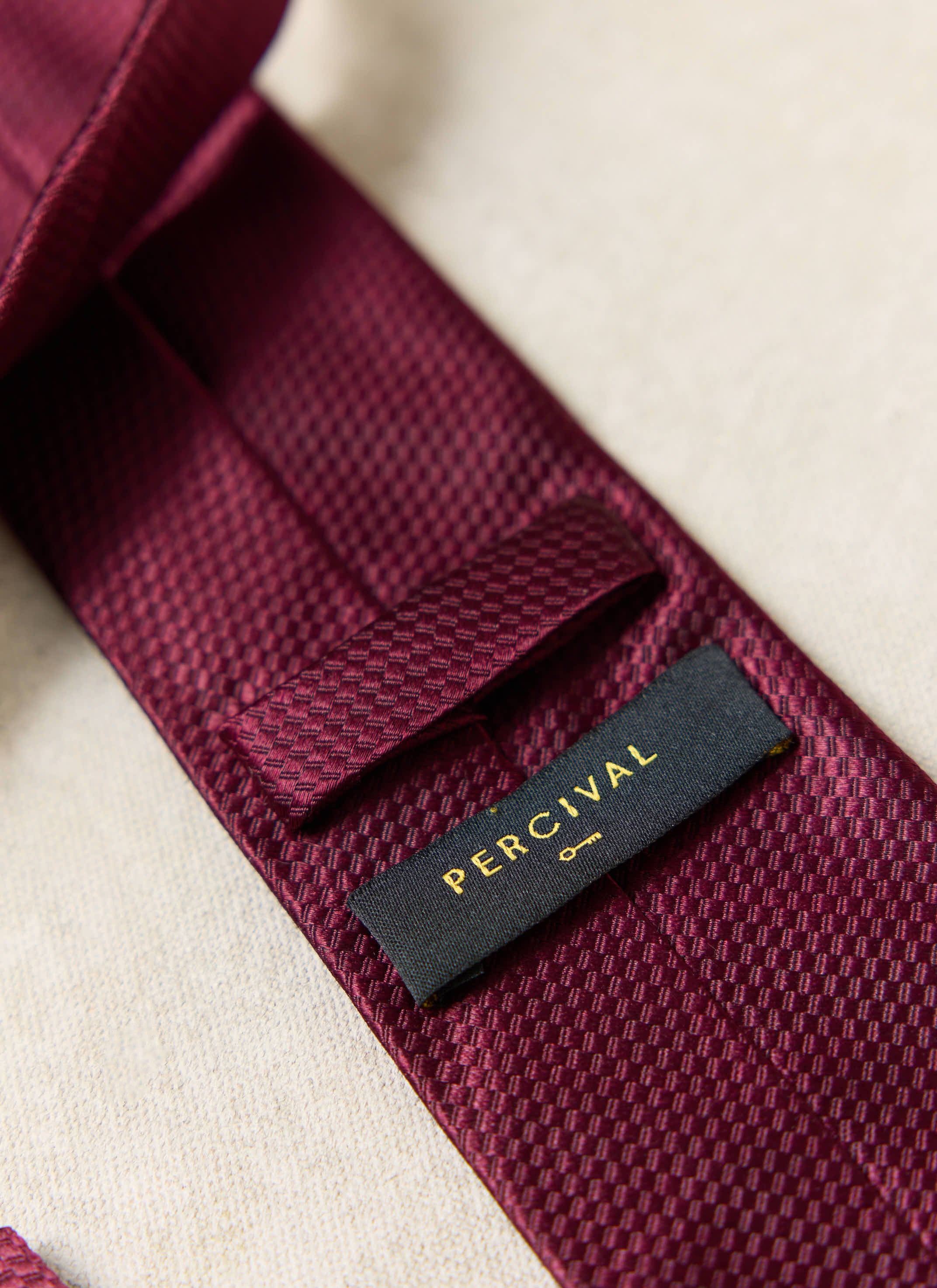 Red, showing the textured weave and brand label on the reverse.