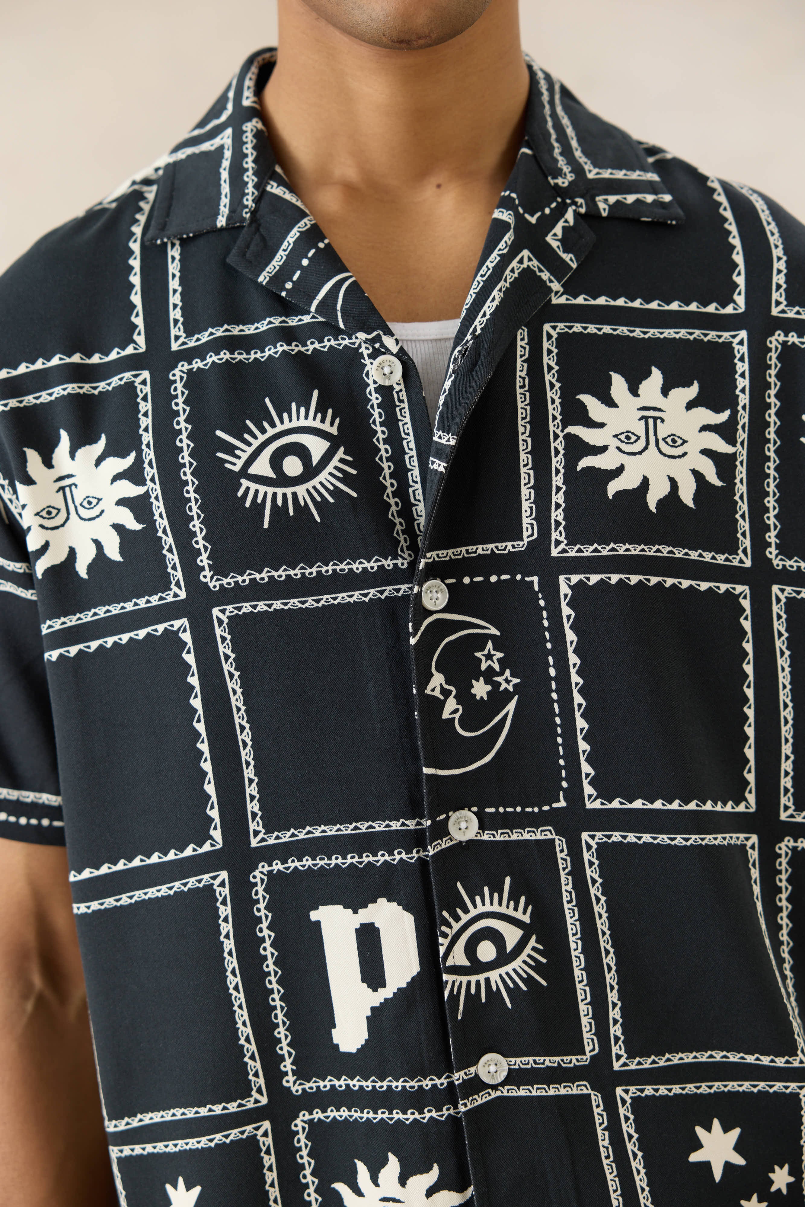 The Percival Lunar Panel Cuban Shirt in black viscose, featuring white celestial graphics and a classic button front.