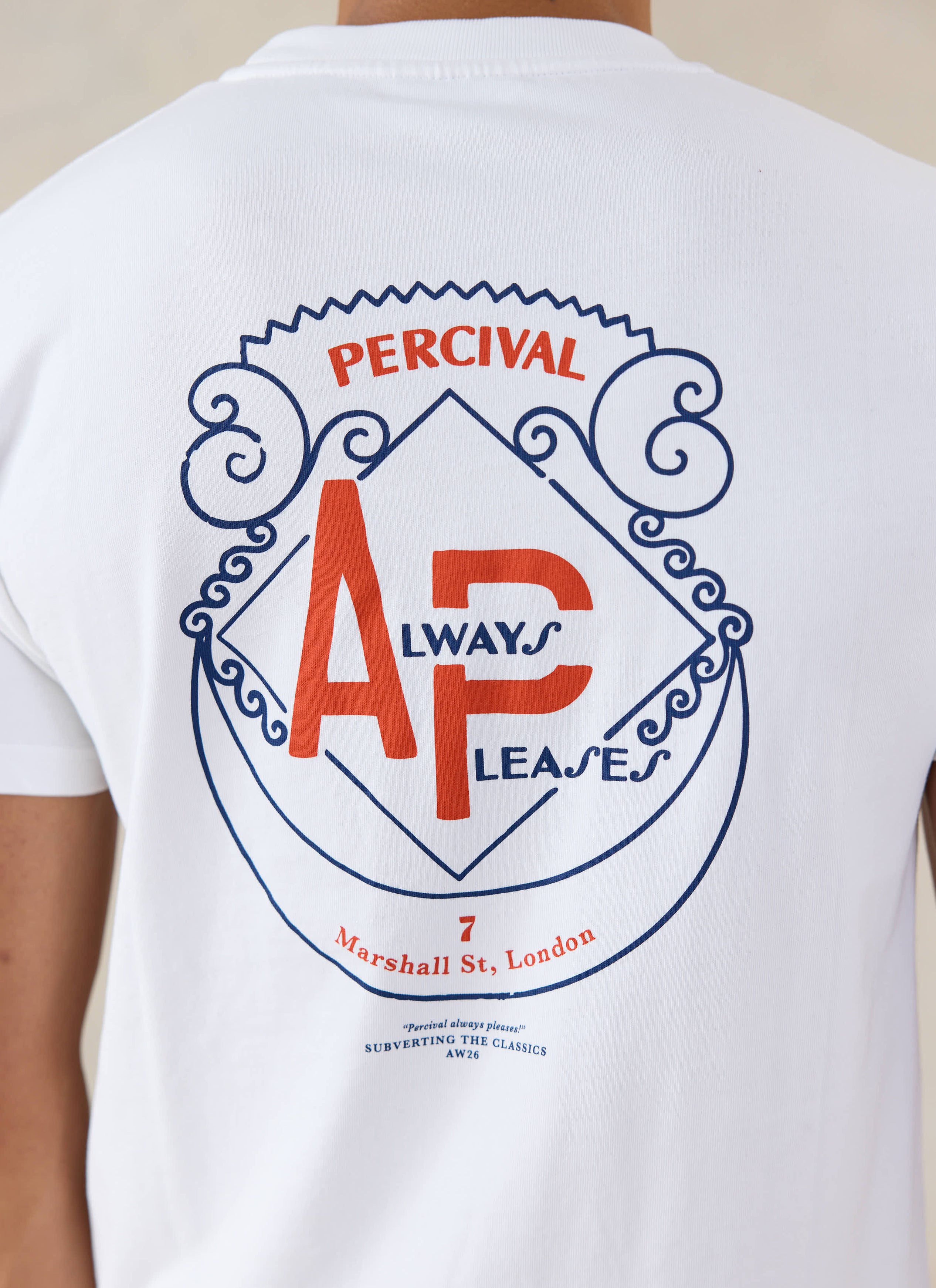 A close-up of the back of the white Percival Cyril T-shirt, showing the large Always Pleases back graphic.