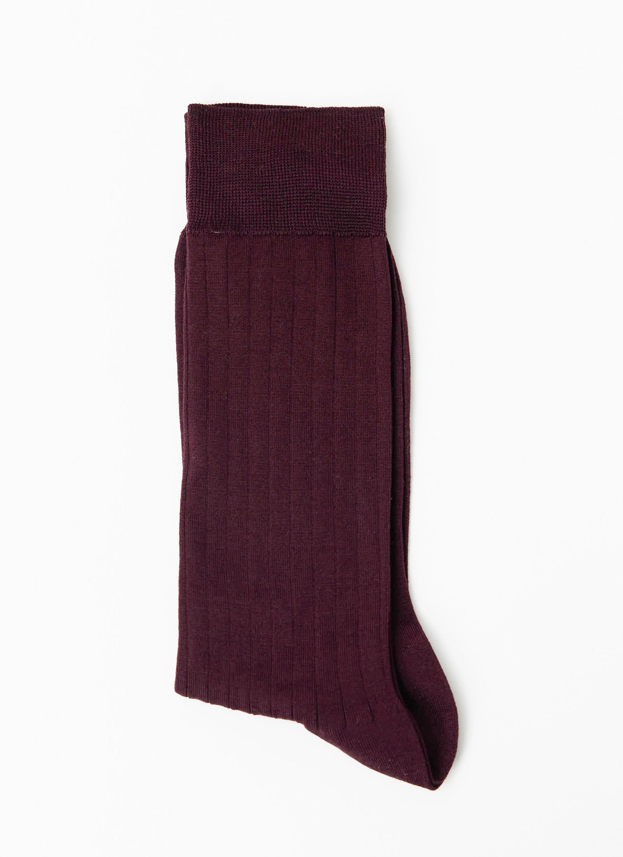 A single Percival Loafer Dress Sock in merlot, folded to display the ribbed cotton texture against a white background.