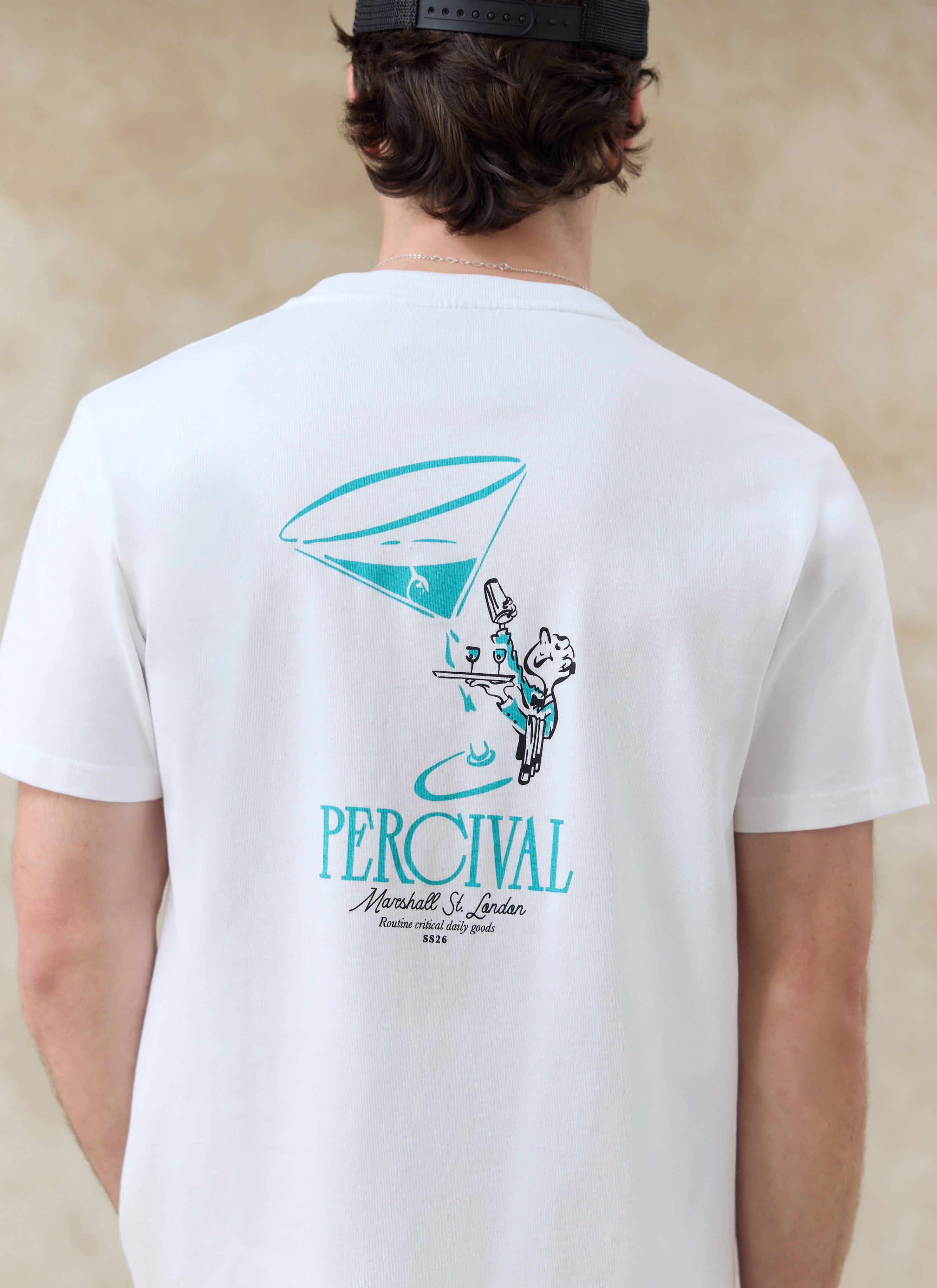 White Percival Walker organic cotton t-shirt, featuring a blue martini and waiter graphic on the back.