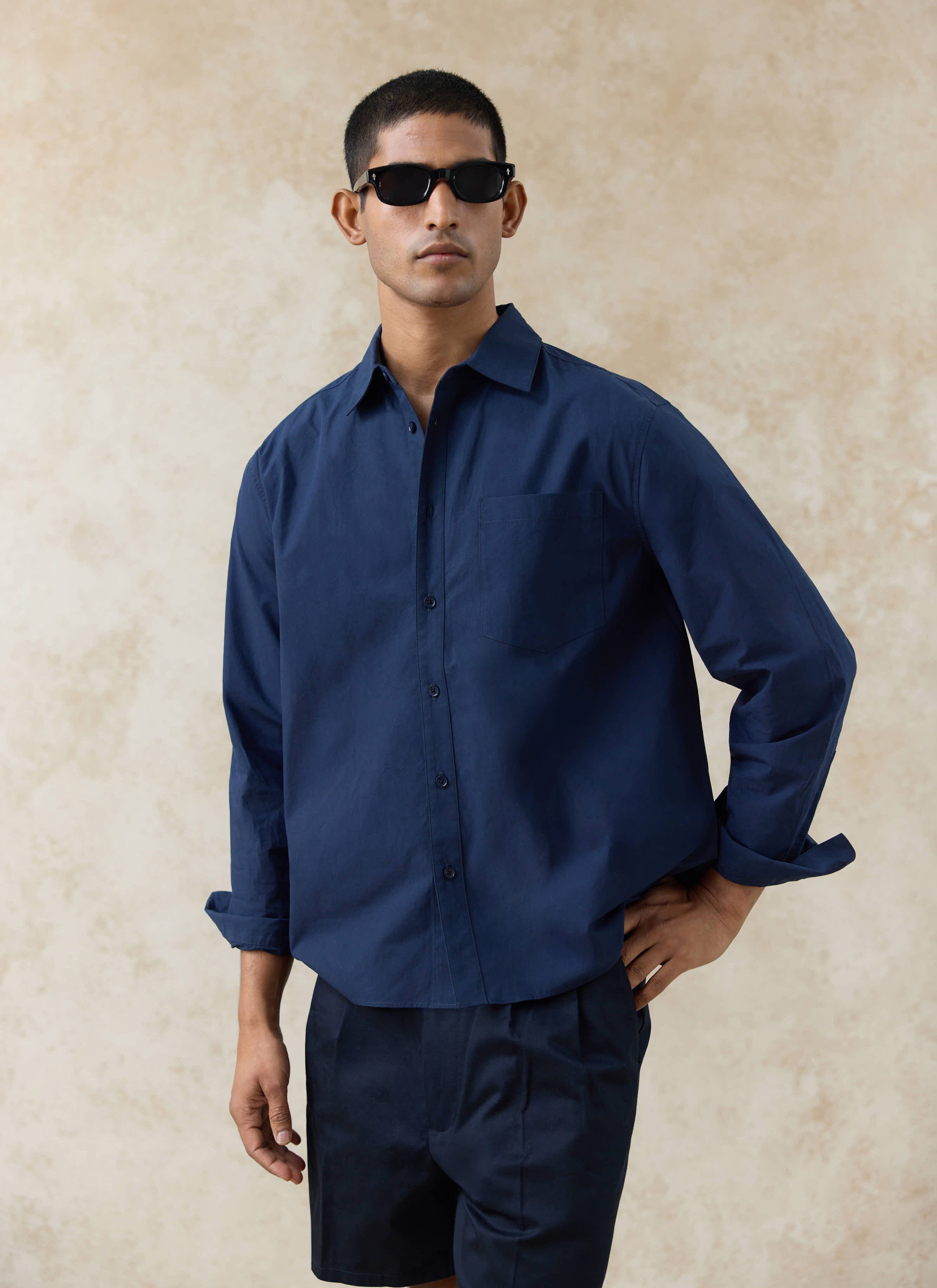 Navy Percival Dali Relaxed Poplin Shirt in paper-touch cotton, featuring a chest pocket and relaxed fit on a model.