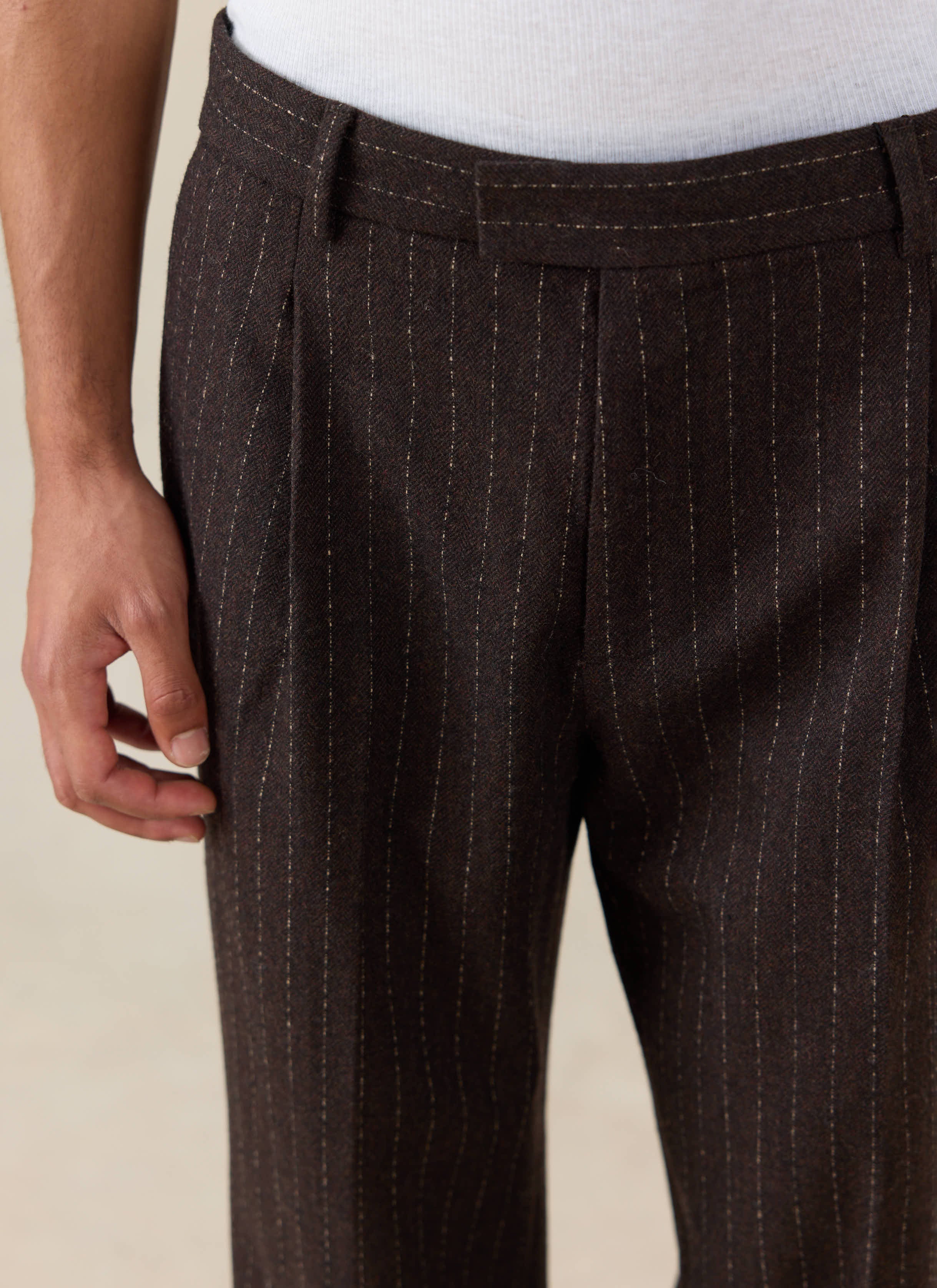 Percival Clifton Pinstripe Pleated Tailored Trousers in espresso, showing the pinstripe and pleat detailing.