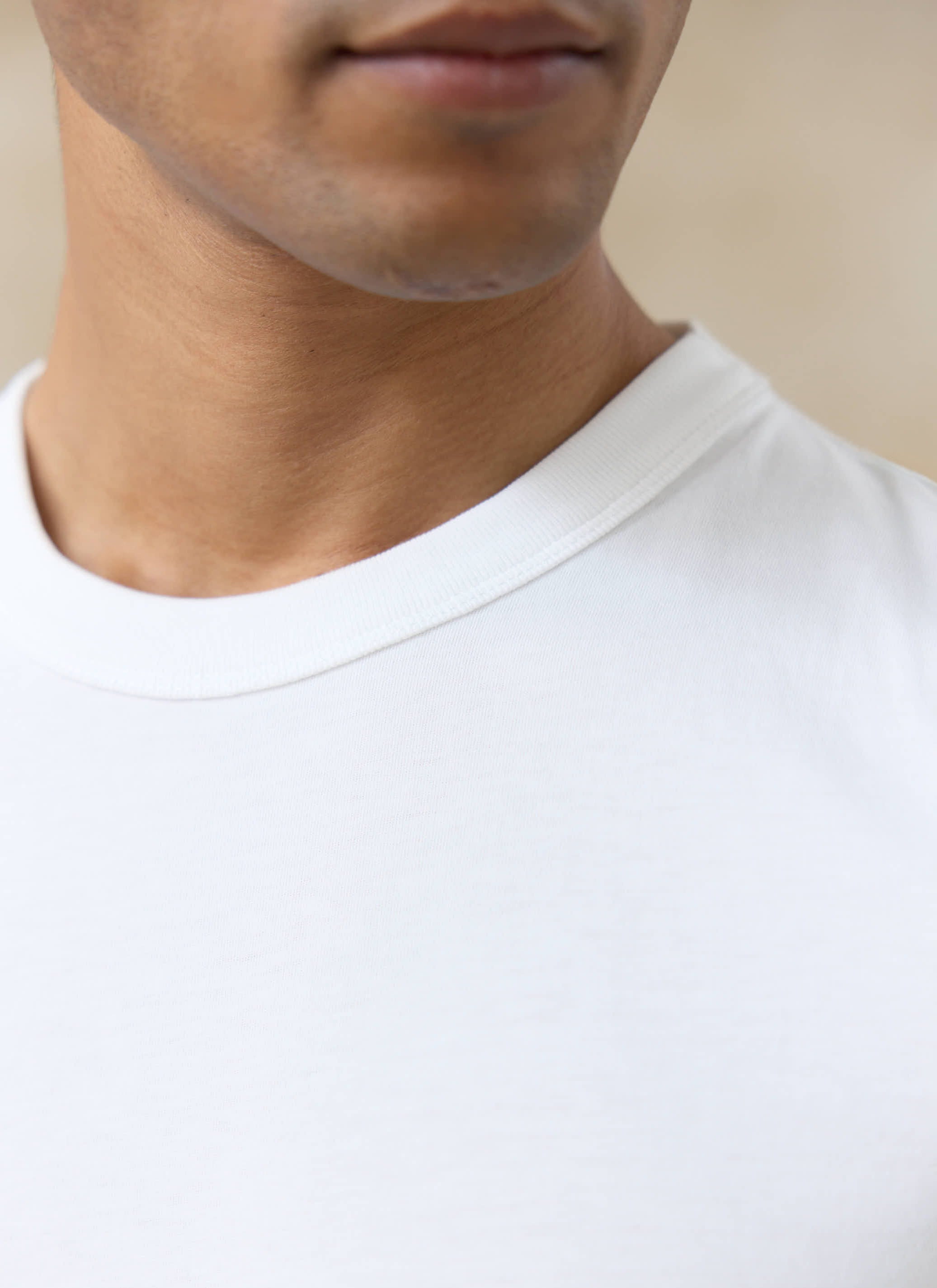 Off-white Percival Austin Slub T-shirt in organic cotton, showing a close-up of the ribbed crew neck and slub texture.