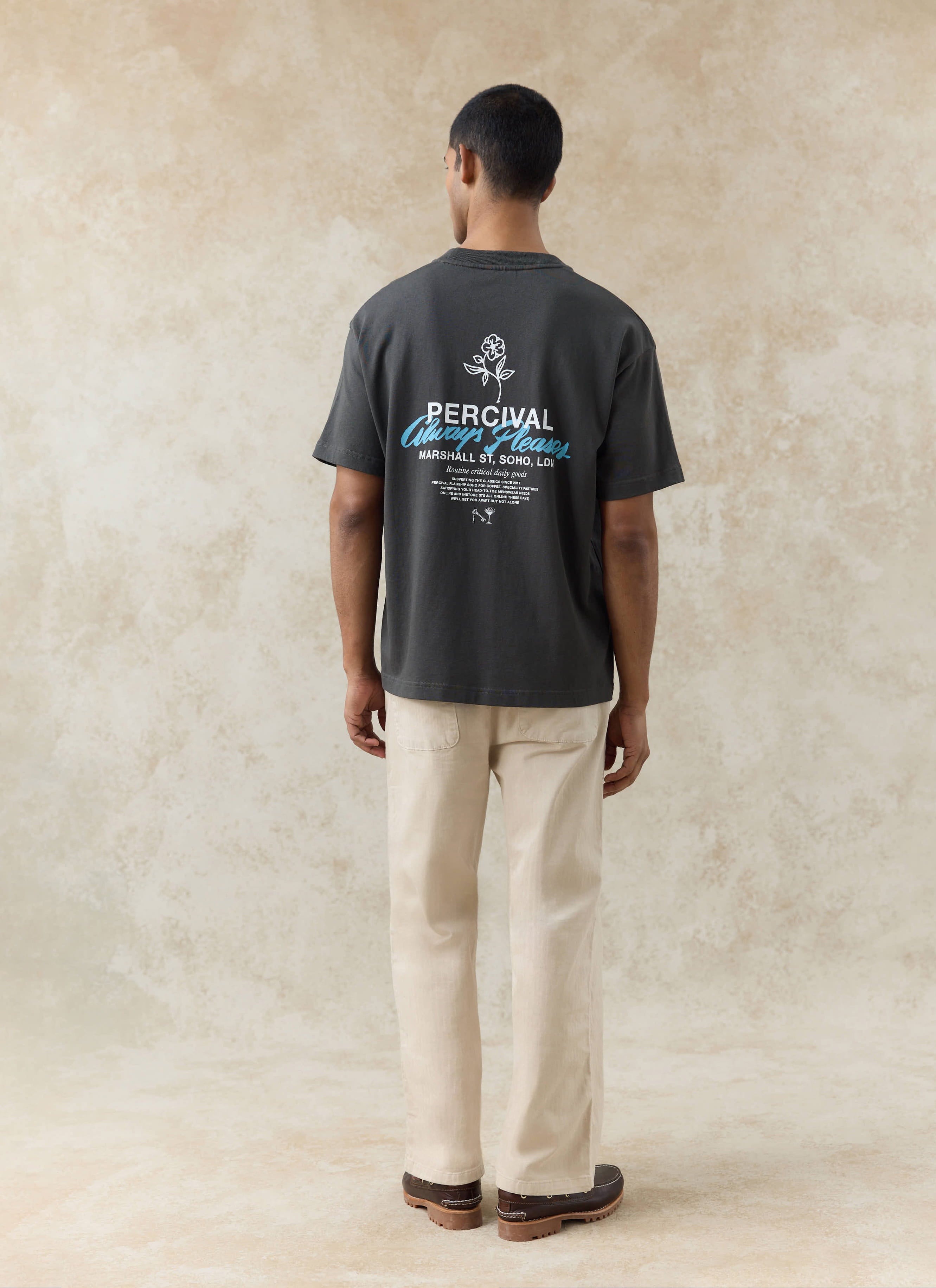 Rear view of the charcoal Percival Otto oversized T-shirt in organic cotton, featuring a large white and blue back graphic.