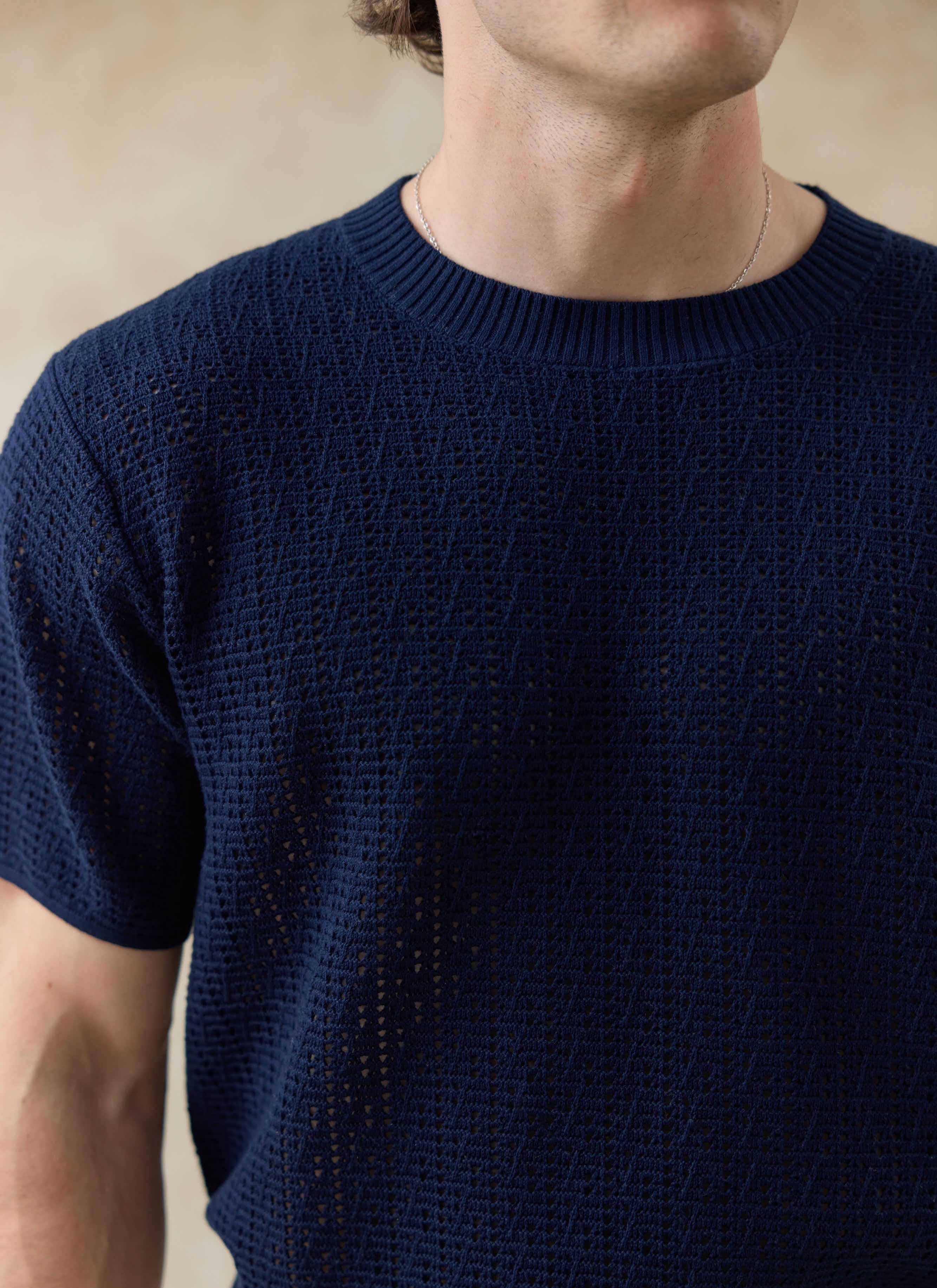 Percival navy Siena Knitted T-Shirt in breathable open-work cotton, showing the textured knit and ribbed crew neck.