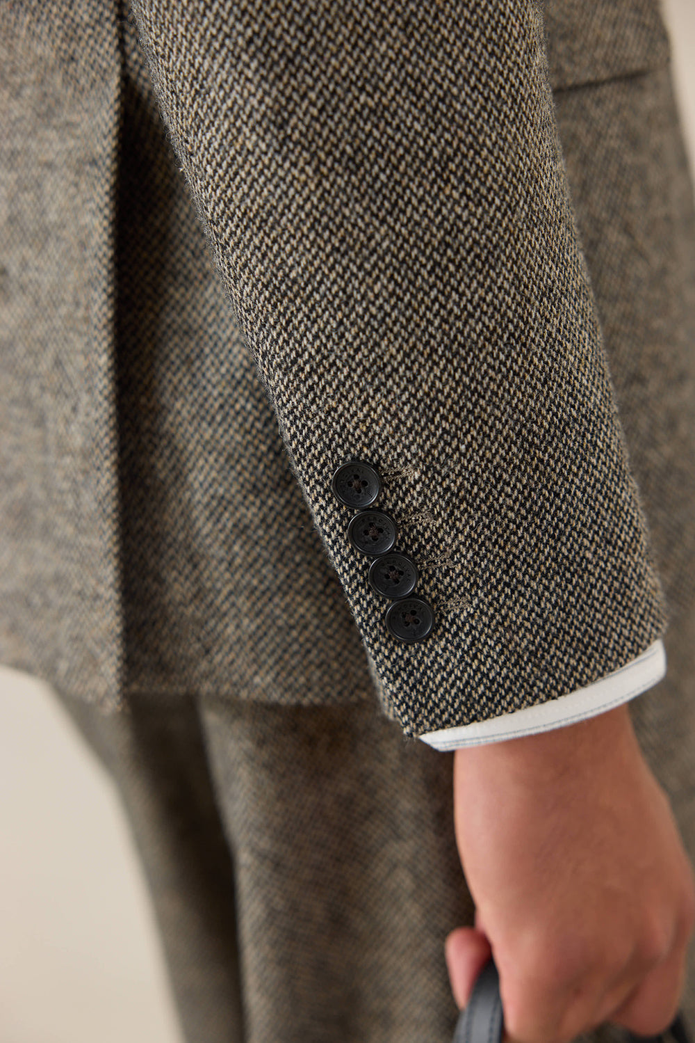 Percival Tailored Blazer in Birdseye Wool Grey, showing a close-up of the four-button cuff and sleeve texture.