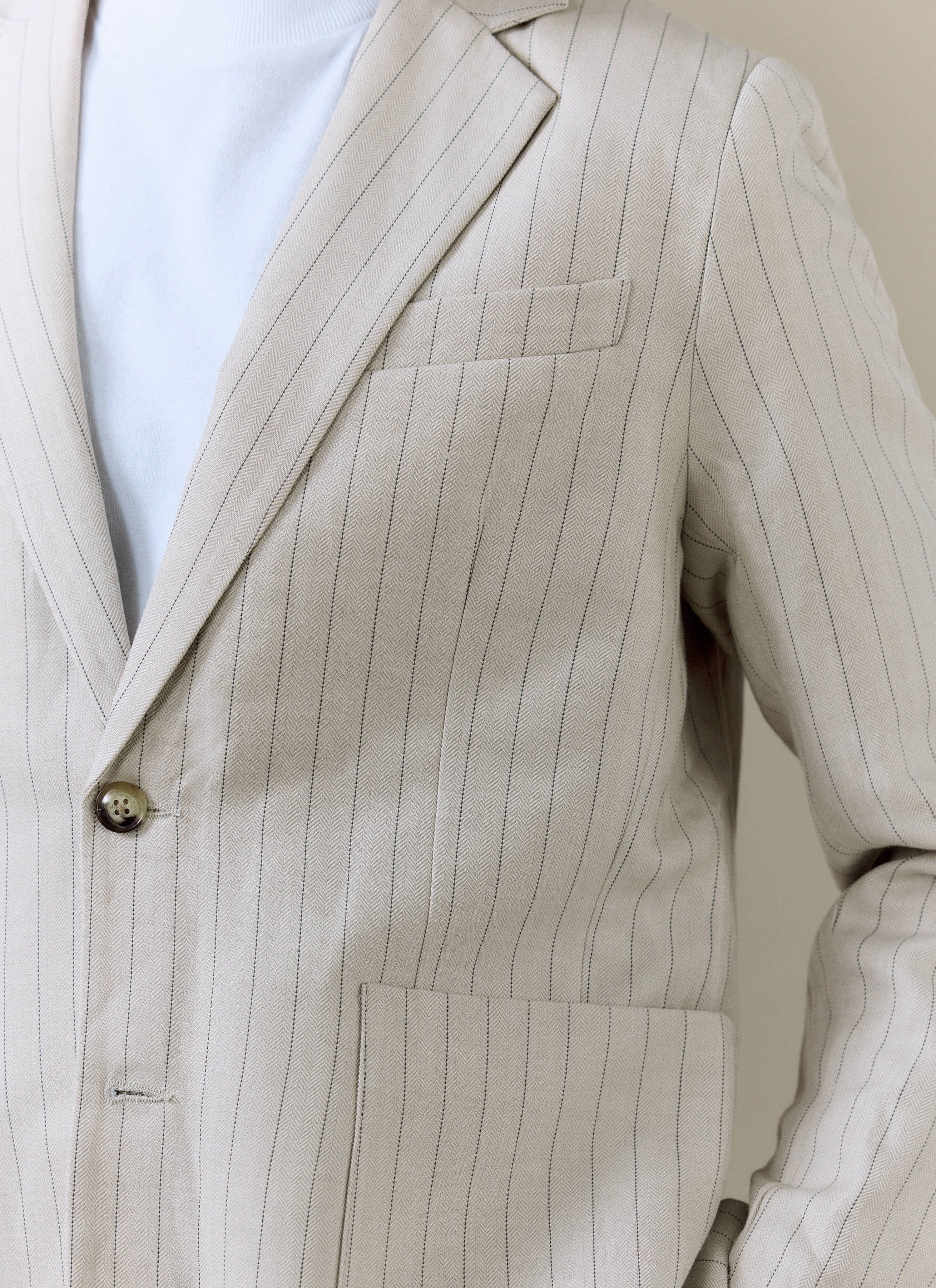 Percival Striped Tailored Blazer in cream linen blend, featuring subtle pinstripes and a textured herringbone weave.