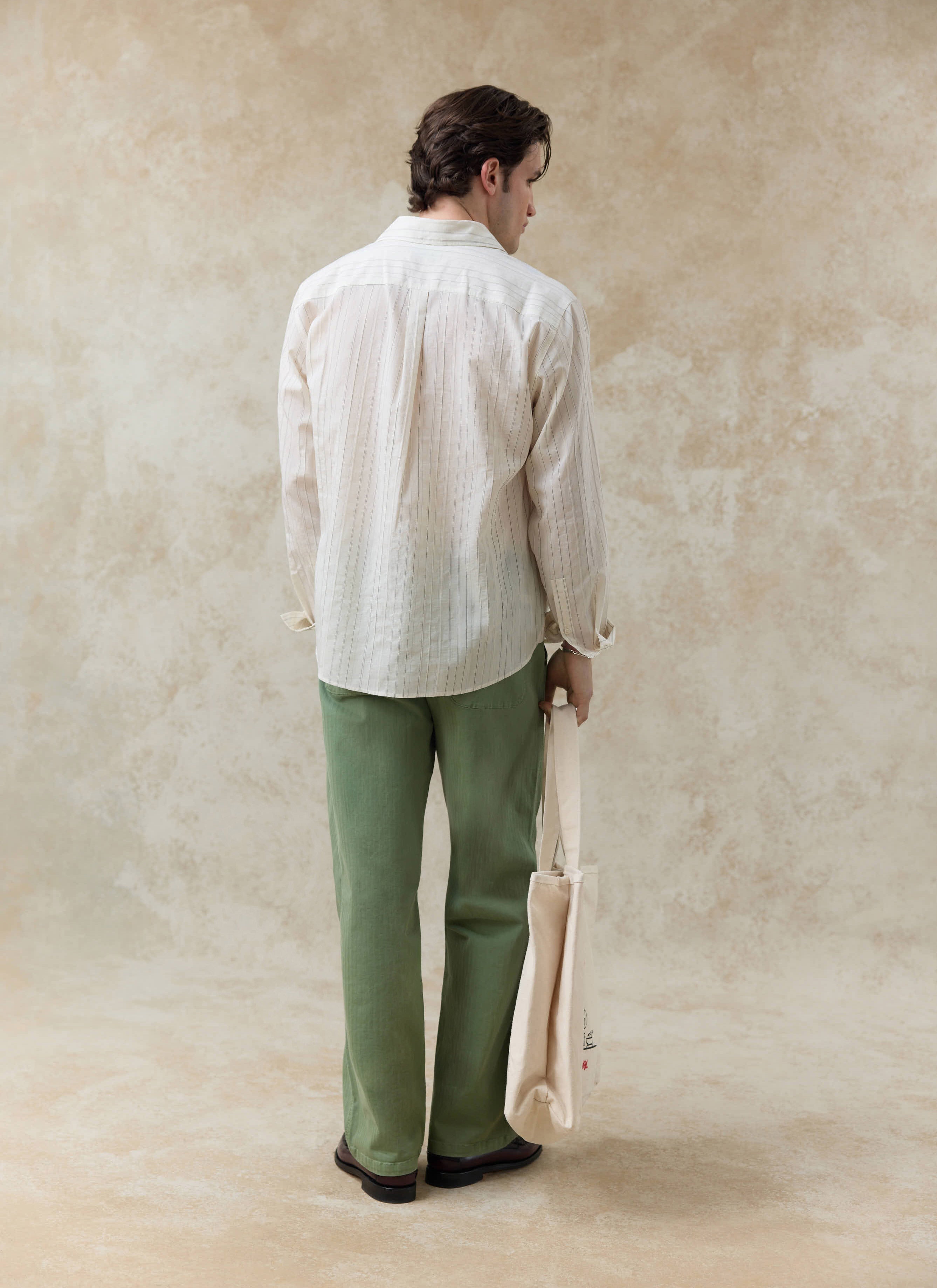 The Percival Lorenzo Pearce Shirt in cream stripe, a breathable lyocell blend long-sleeve shirt shown from the back.