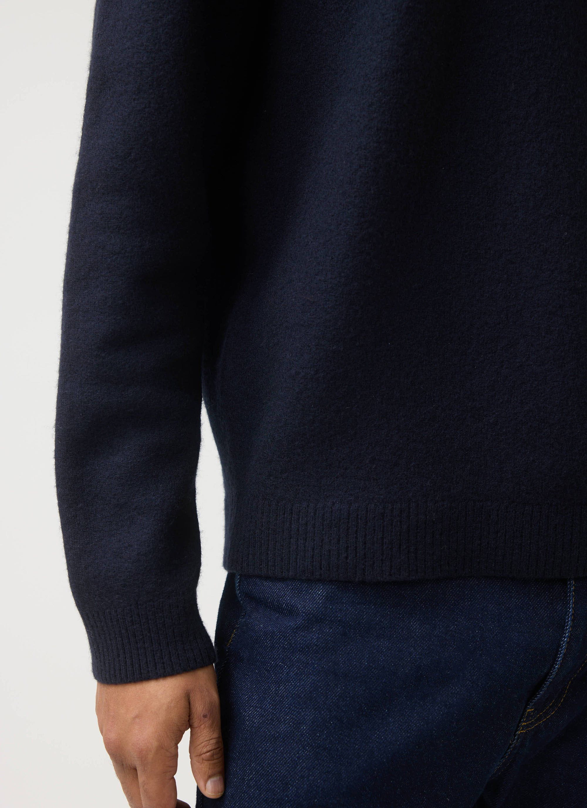 A detailed shot of the Guinness x Percival navy merino wool jumper, highlighting the rich texture of the fabric.