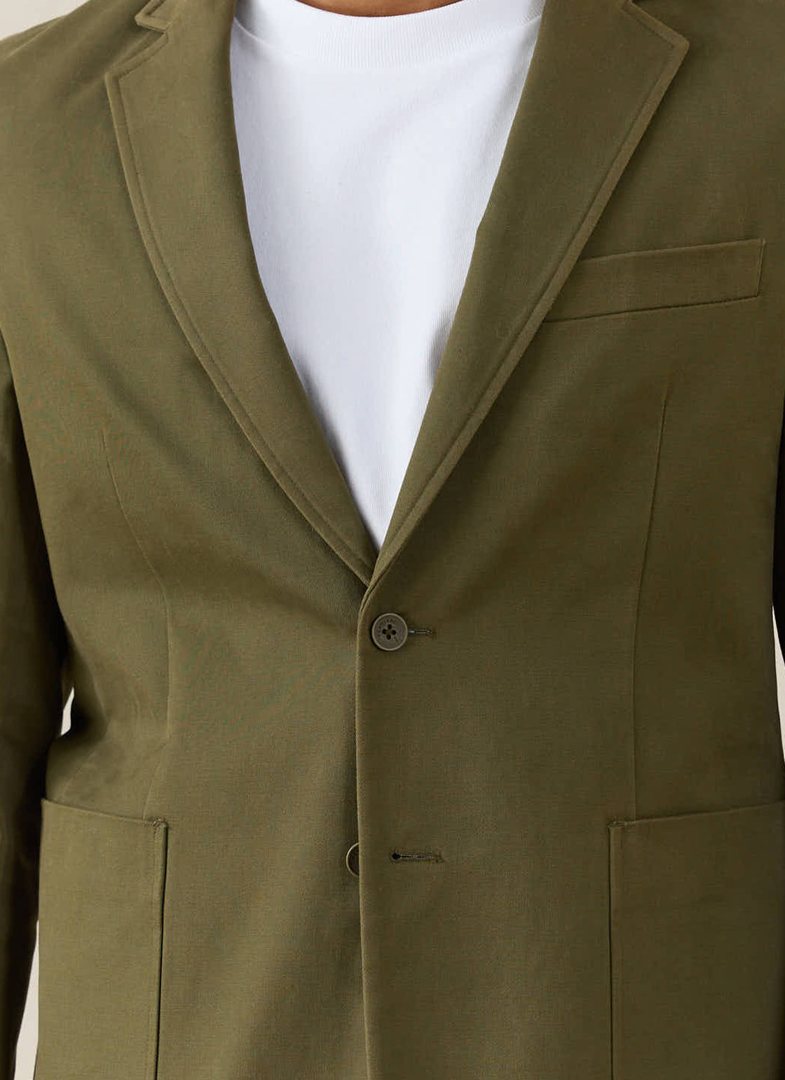 A close-up of the Percival Tailored Blazer in Forest Brushed Moleskin.