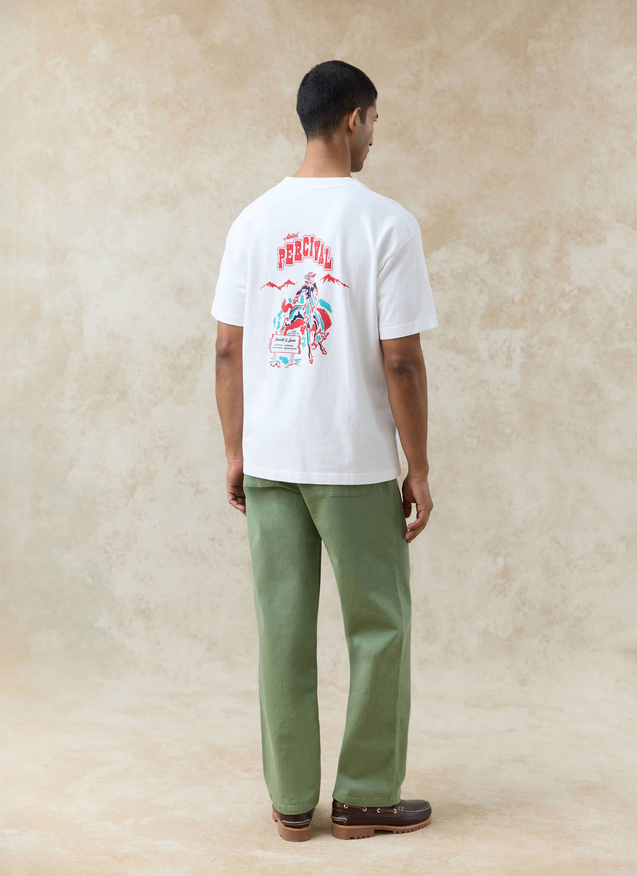 White Percival Gordon Oversized T Shirt in organic cotton, featuring a colourful 'Motel Percival' back graphic.