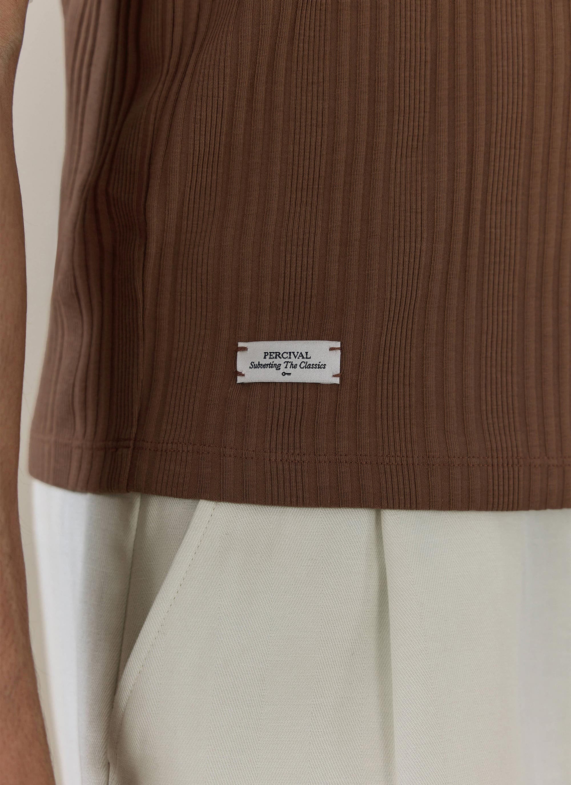 Close-up of the espresso brown Percival Leon Slim Ribbed T Shirt, showing the vertical ribbing and white brand label.