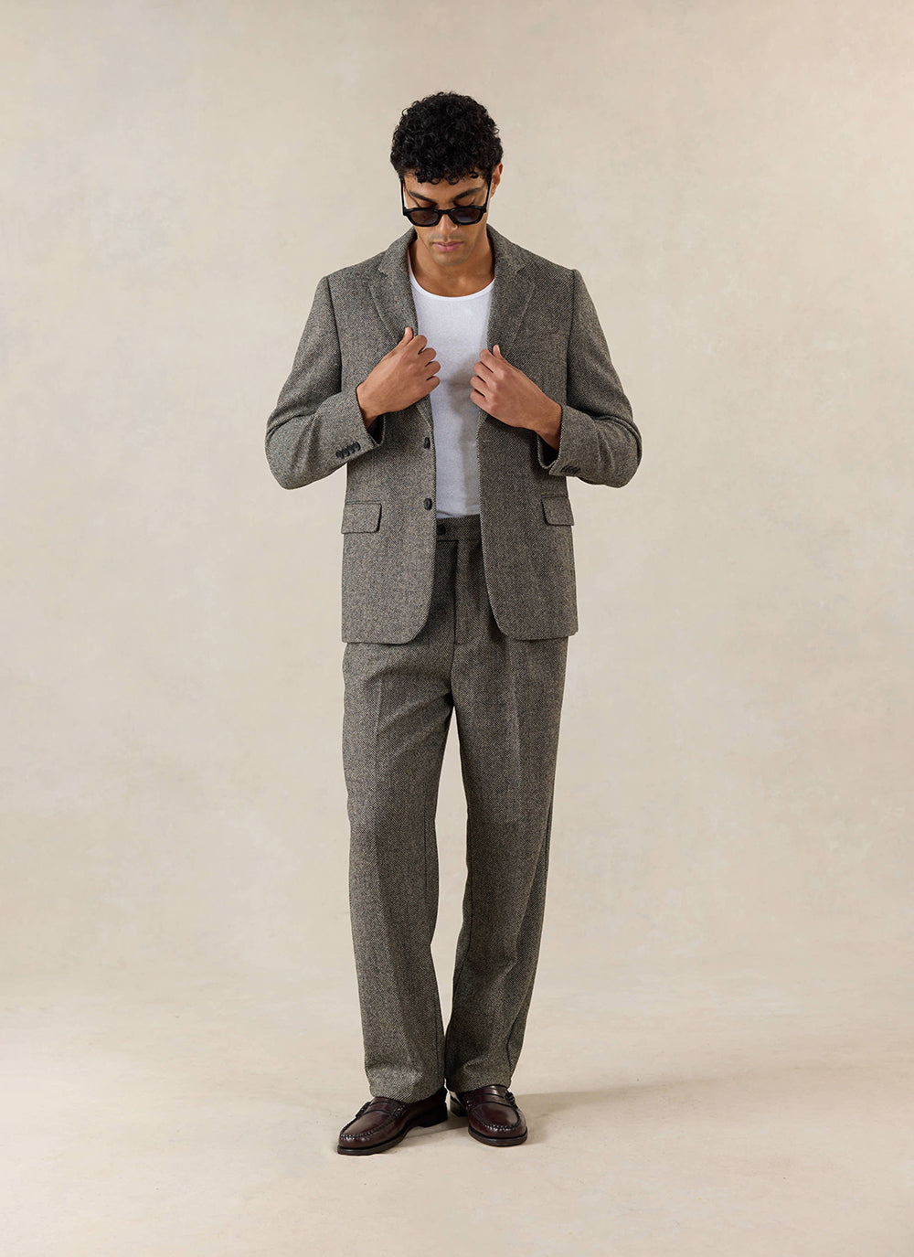 Percival Blake Double Pleated Tailored Trousers in grey birdseye wool, styled with a matching blazer and white t-shirt.