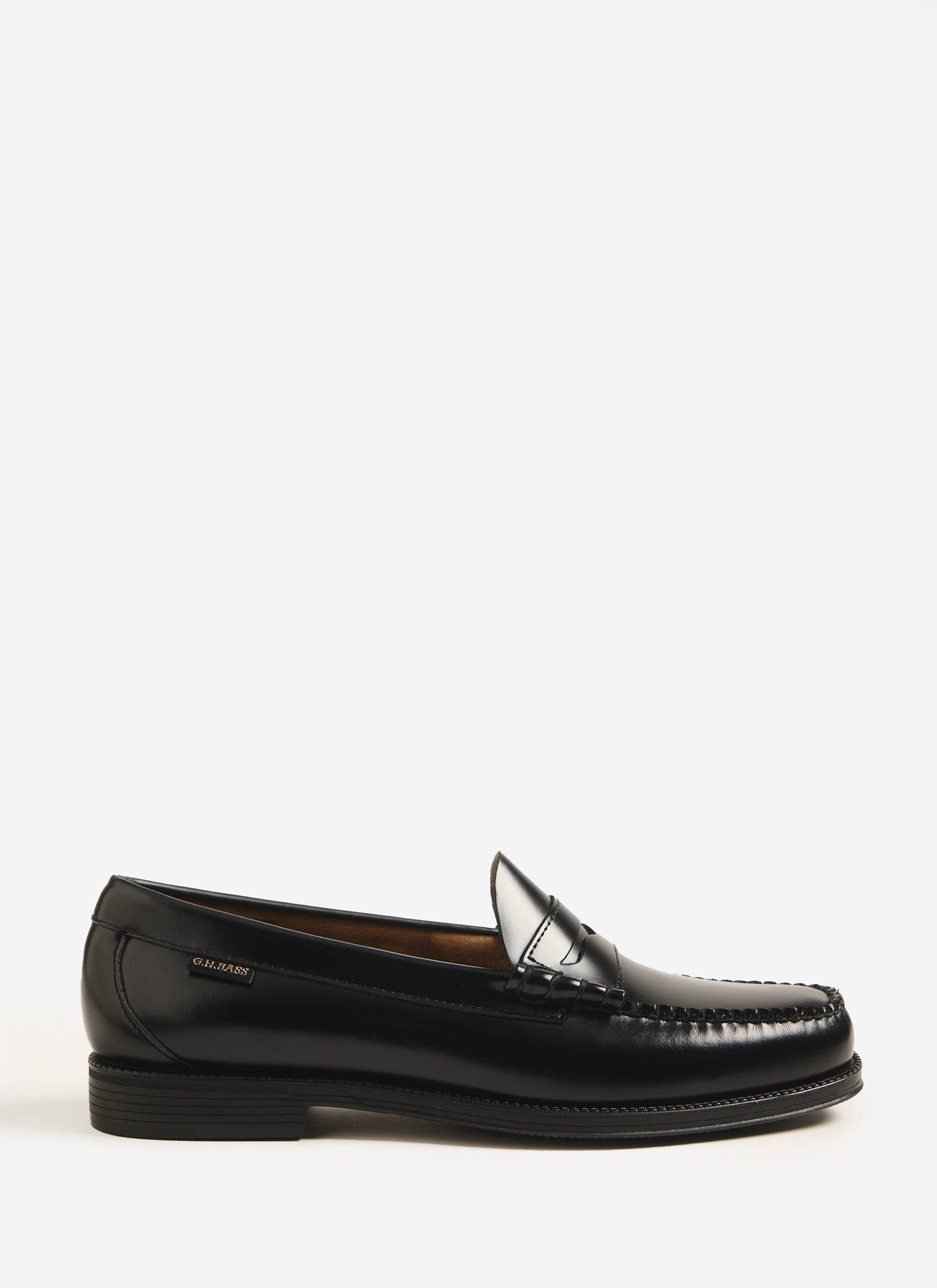 A side profile of the G.H. Bass Weejuns Larson Flag loafer in black polished leather, available from Percival.