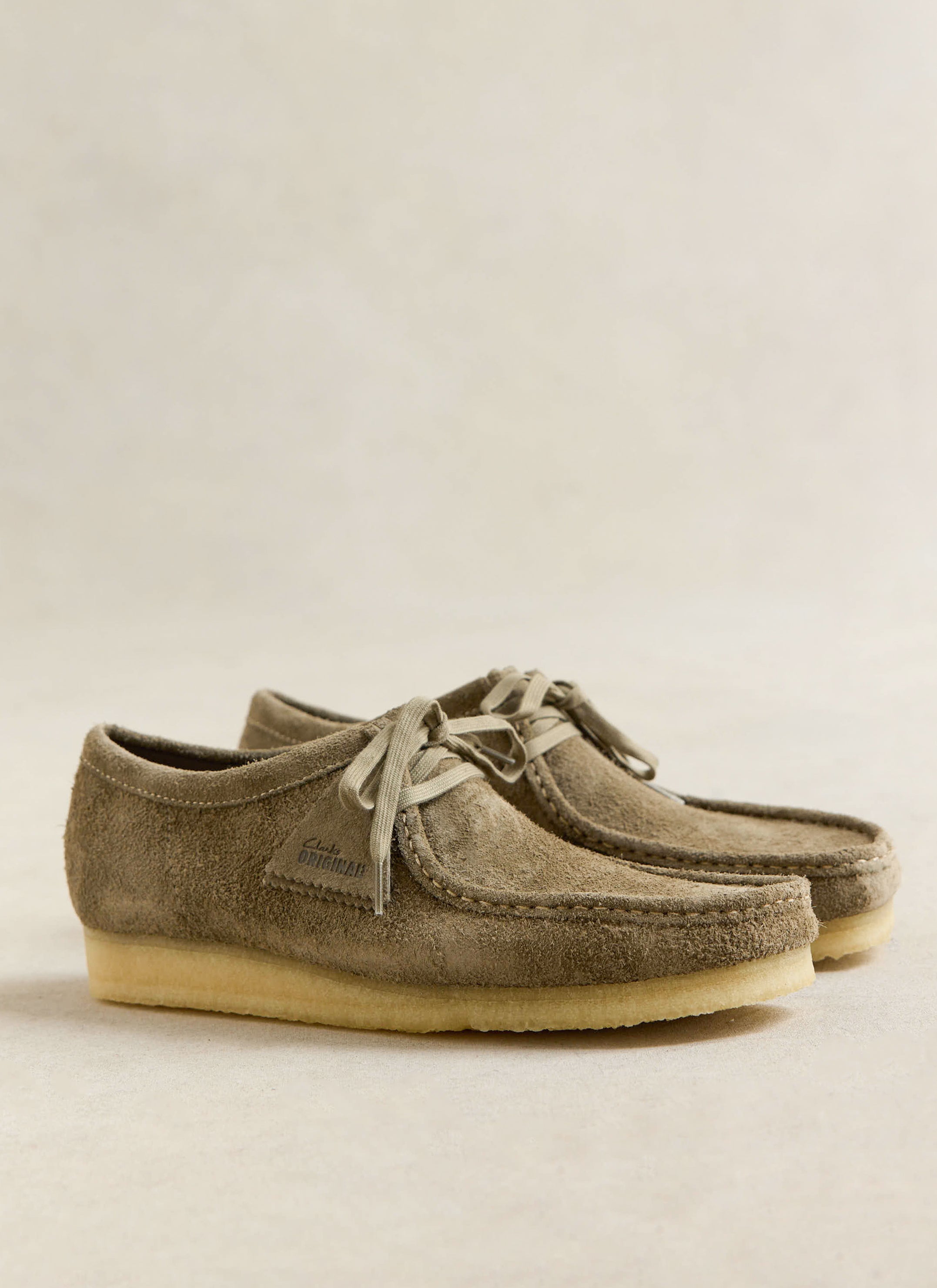 Smoke grey suede Clarks Originals Wallabee shoes featuring crepe soles and moccasin stitching from Percival.