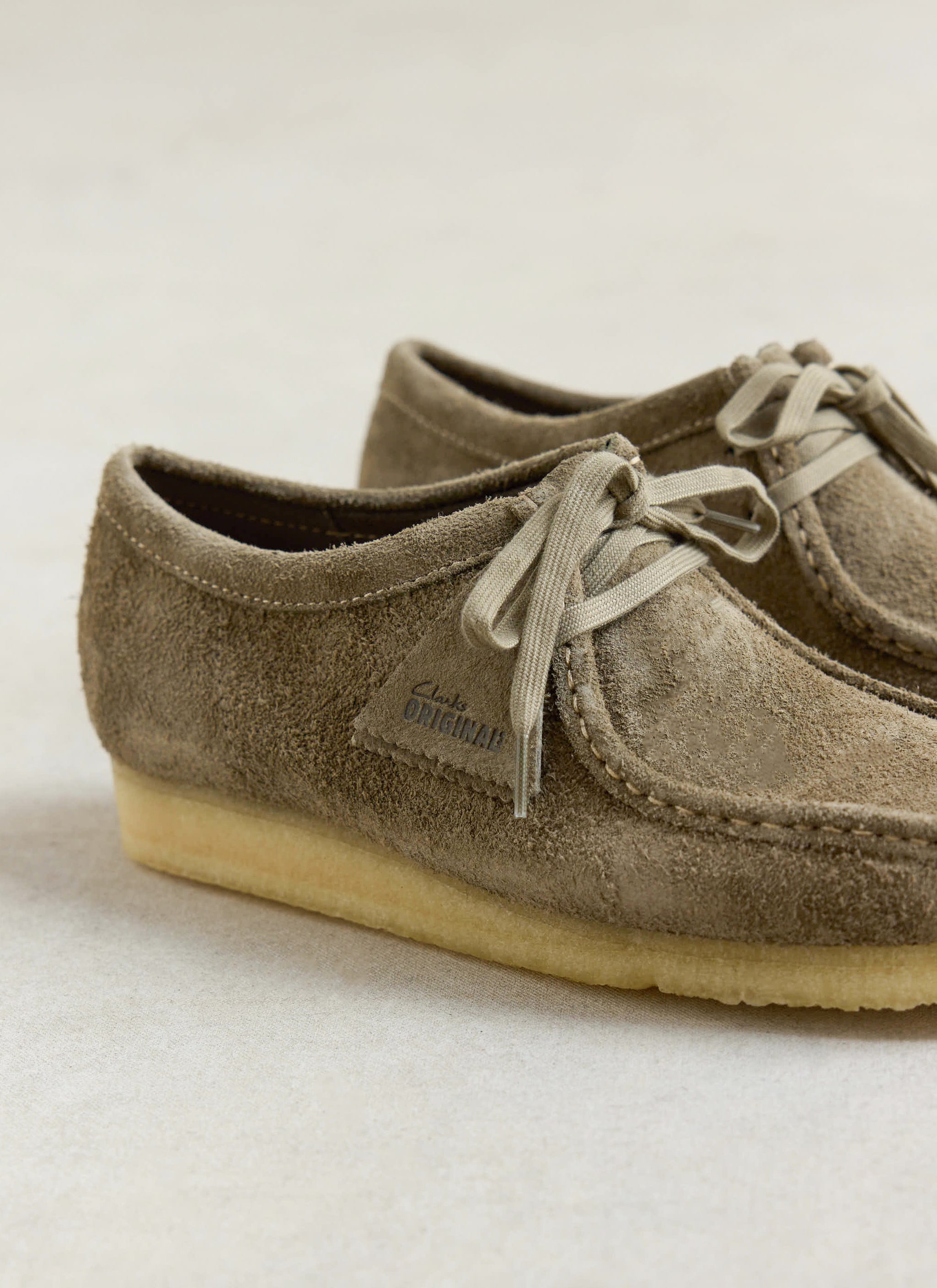 Smoke grey suede Clarks Originals Wallabees from Percival, featuring a hand-stitched apron and natural crepe sole.