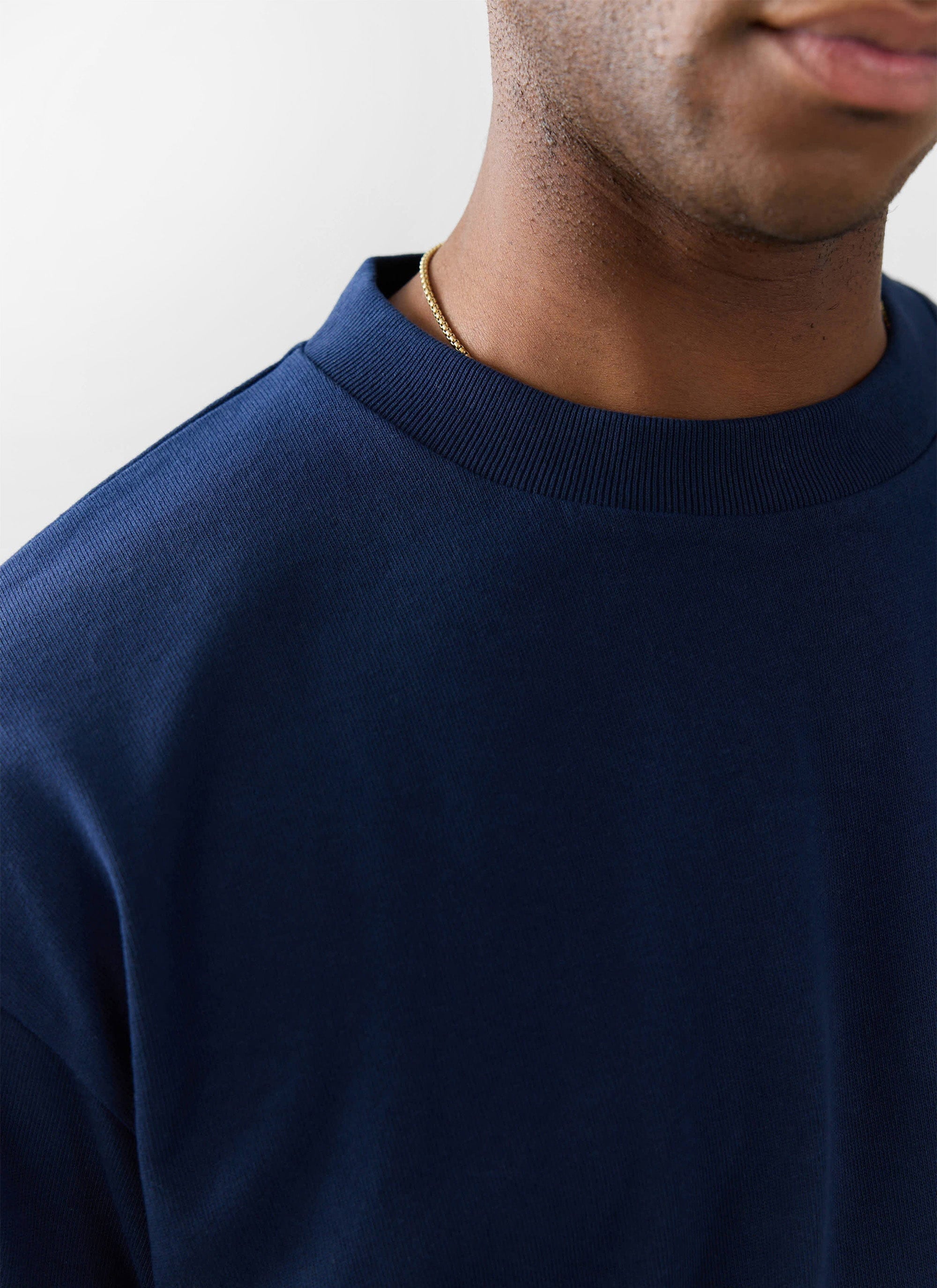 Close up of the ribbed collar on the navy oversized organic cotton t-shirt by Percival