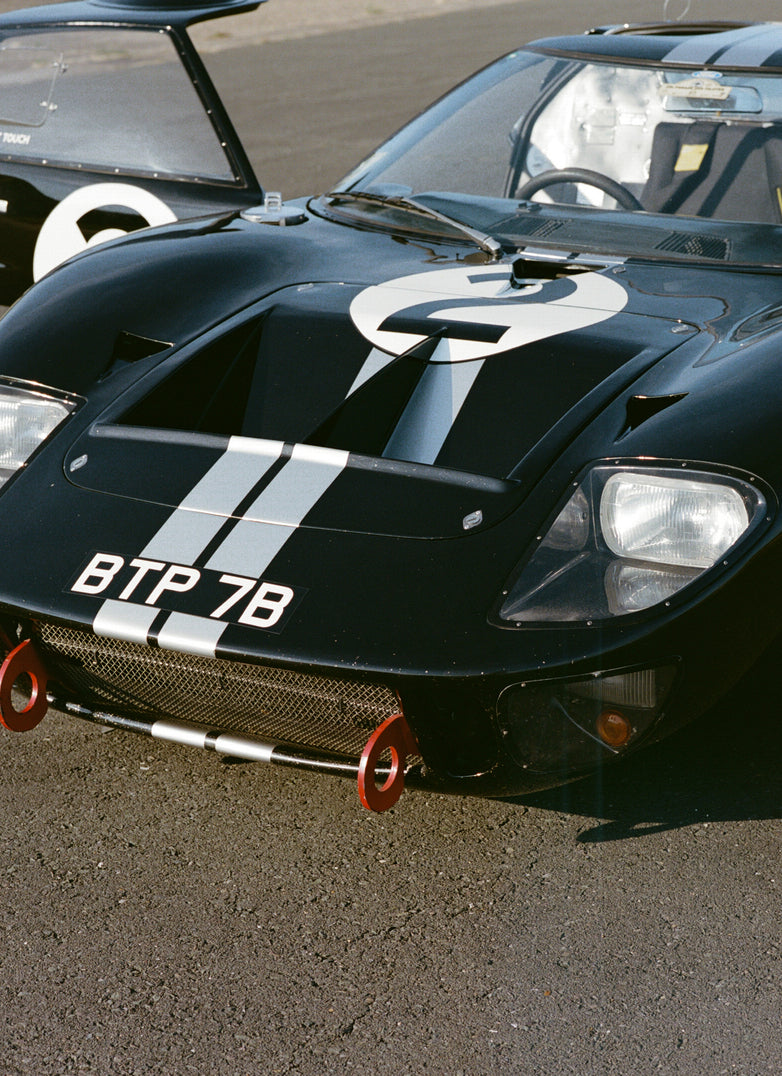 A classic black Ford GT40 with white racing stripes and number 2 decal from the Ford x Percival collection.