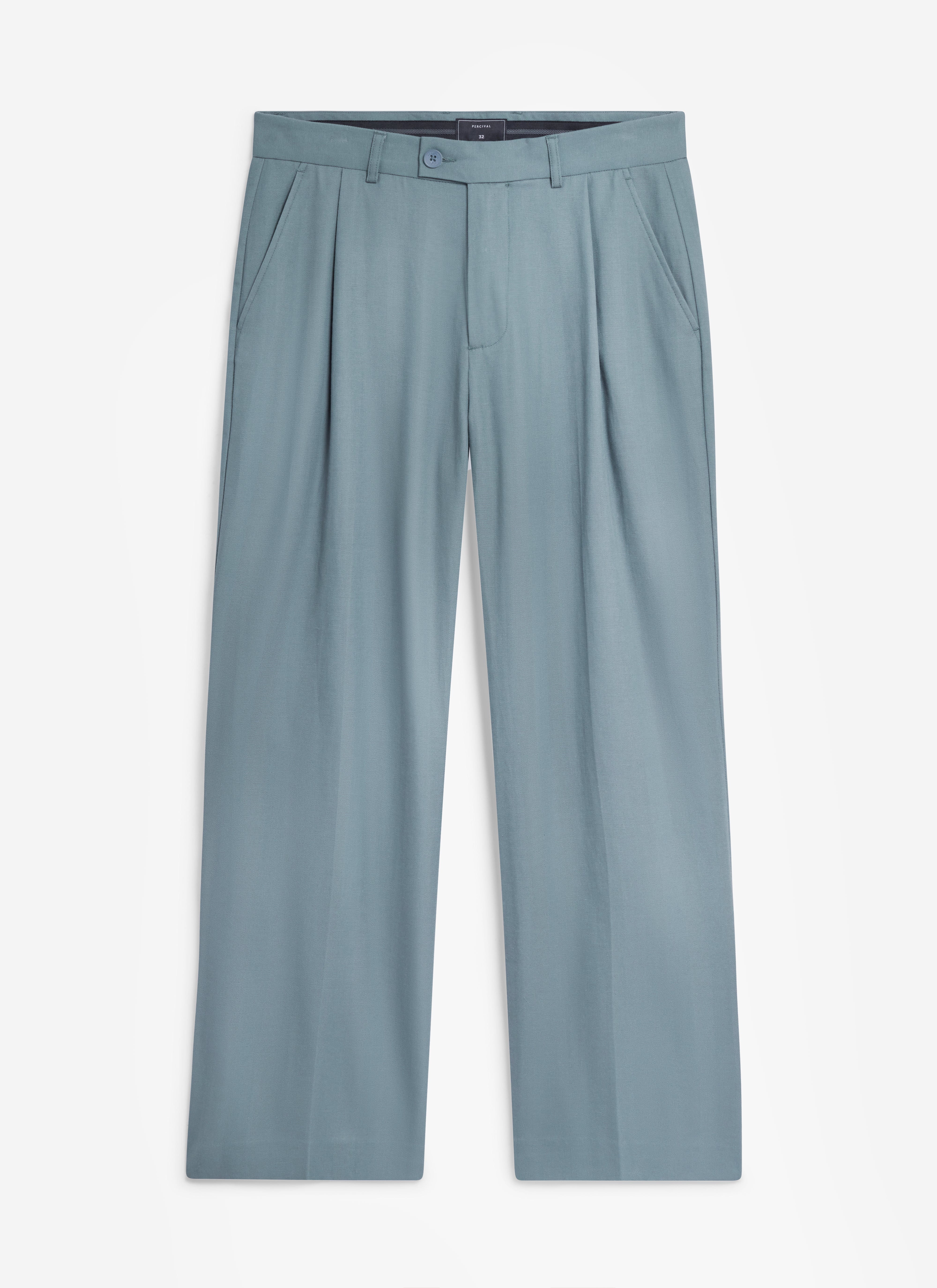 A flat lay of the Percival Pleated Leg Trousers in slate blue, showing the relaxed fit and front pleat details.