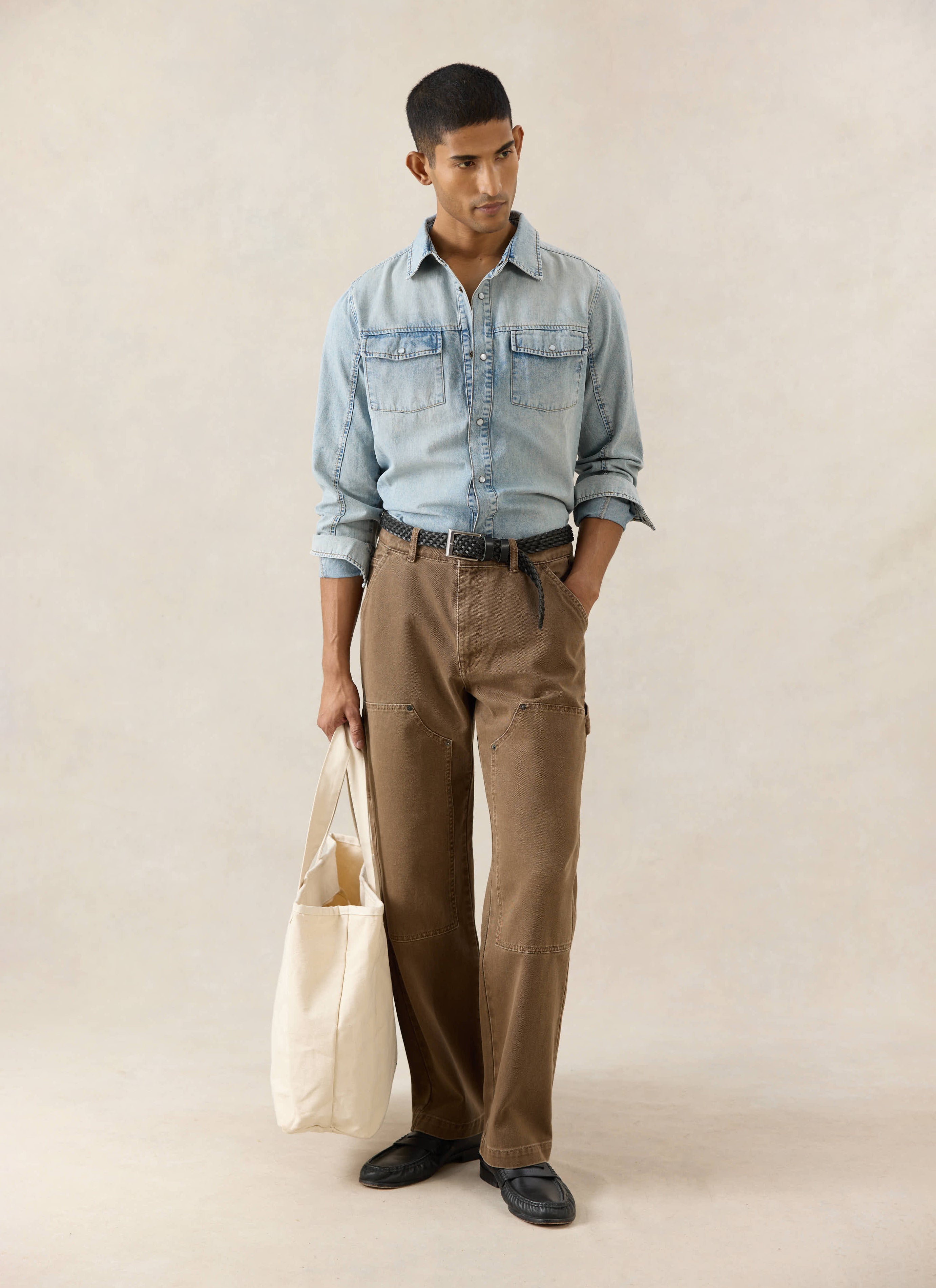 Stone wash denim Percival Western shirt with pearl buttons, paired with brown Lucas carpenter trousers.