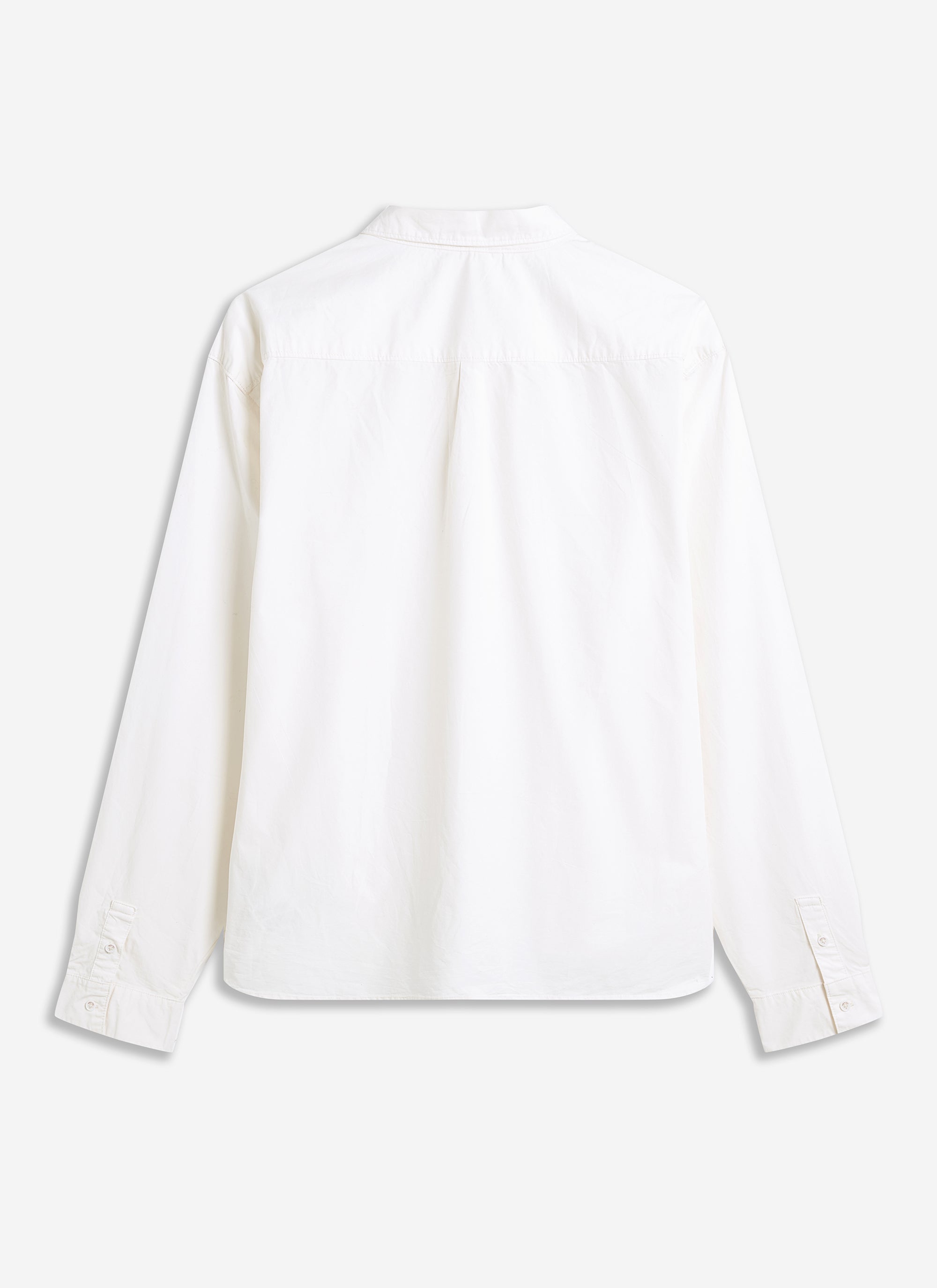 A flat-lay image of the back of the ecru Relaxed Oxford Shirt, part of the Champion x Percival collection.