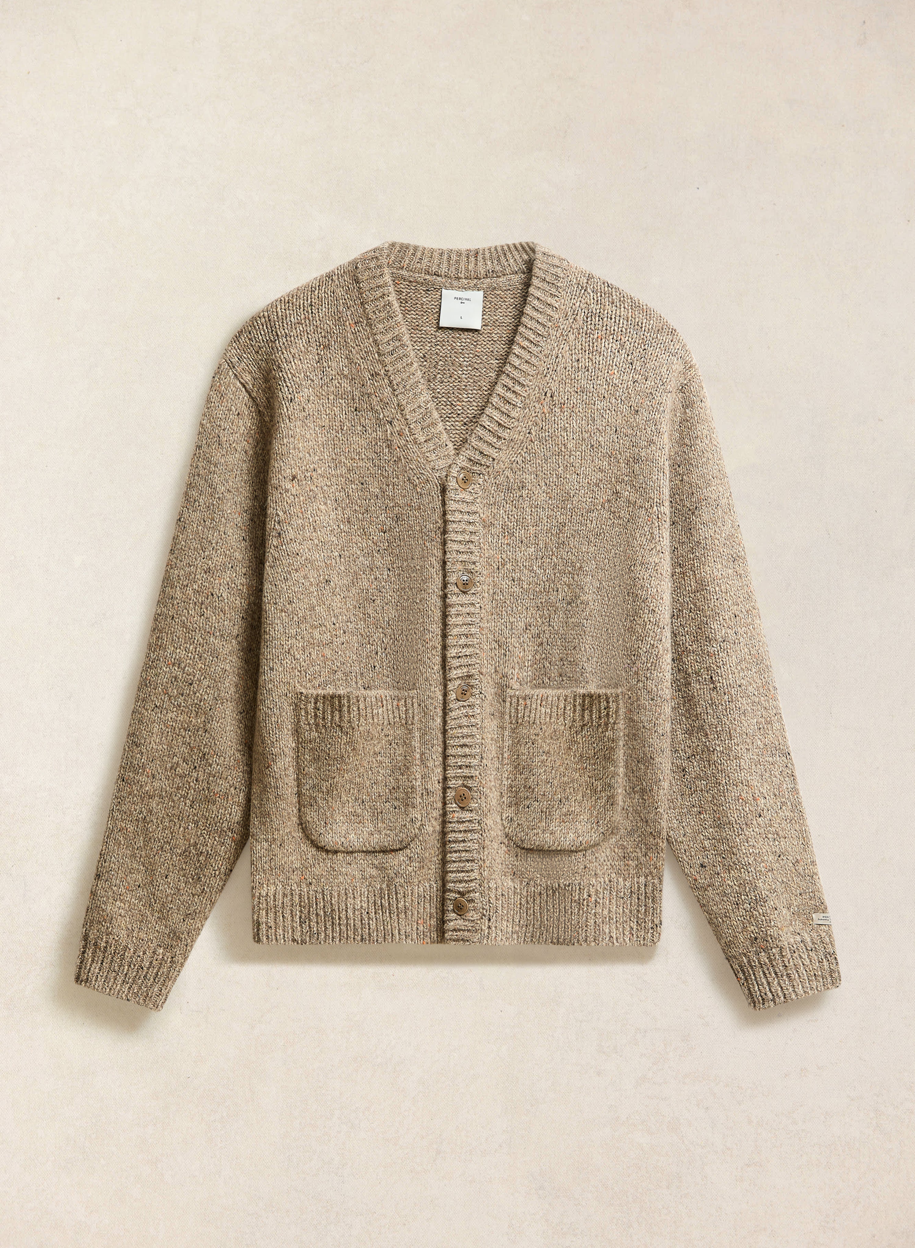 The Percival Rhodes White Glove Cardigan in oak marl, shown laid flat.