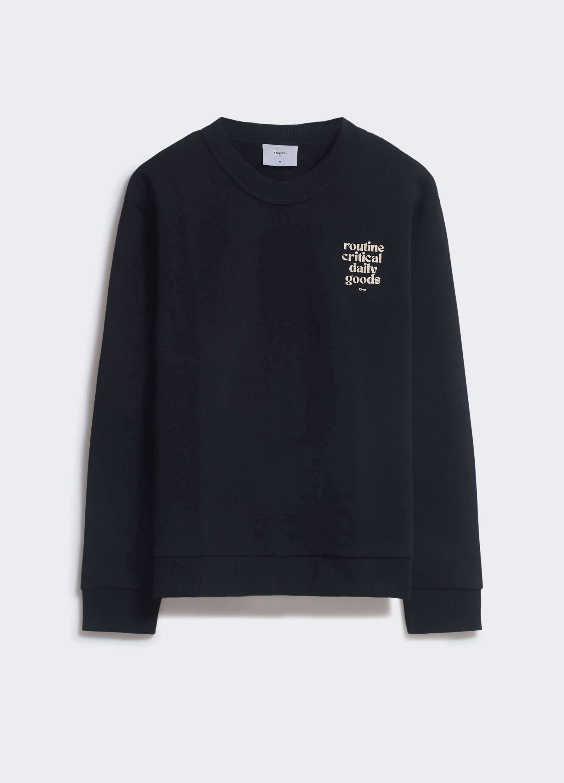 The Percival Routine Sweatshirt in black with white chest text and ribbed trims, shown flat against a plain background.
