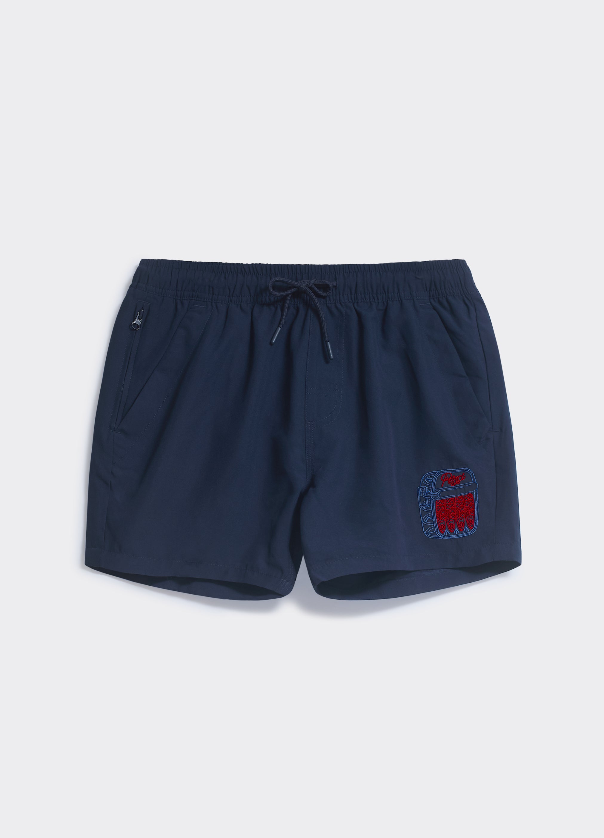 Navy blue Percival Sardines Shorts with a red sardine tin embroidery badge, drawstring waist, and zip pocket details.