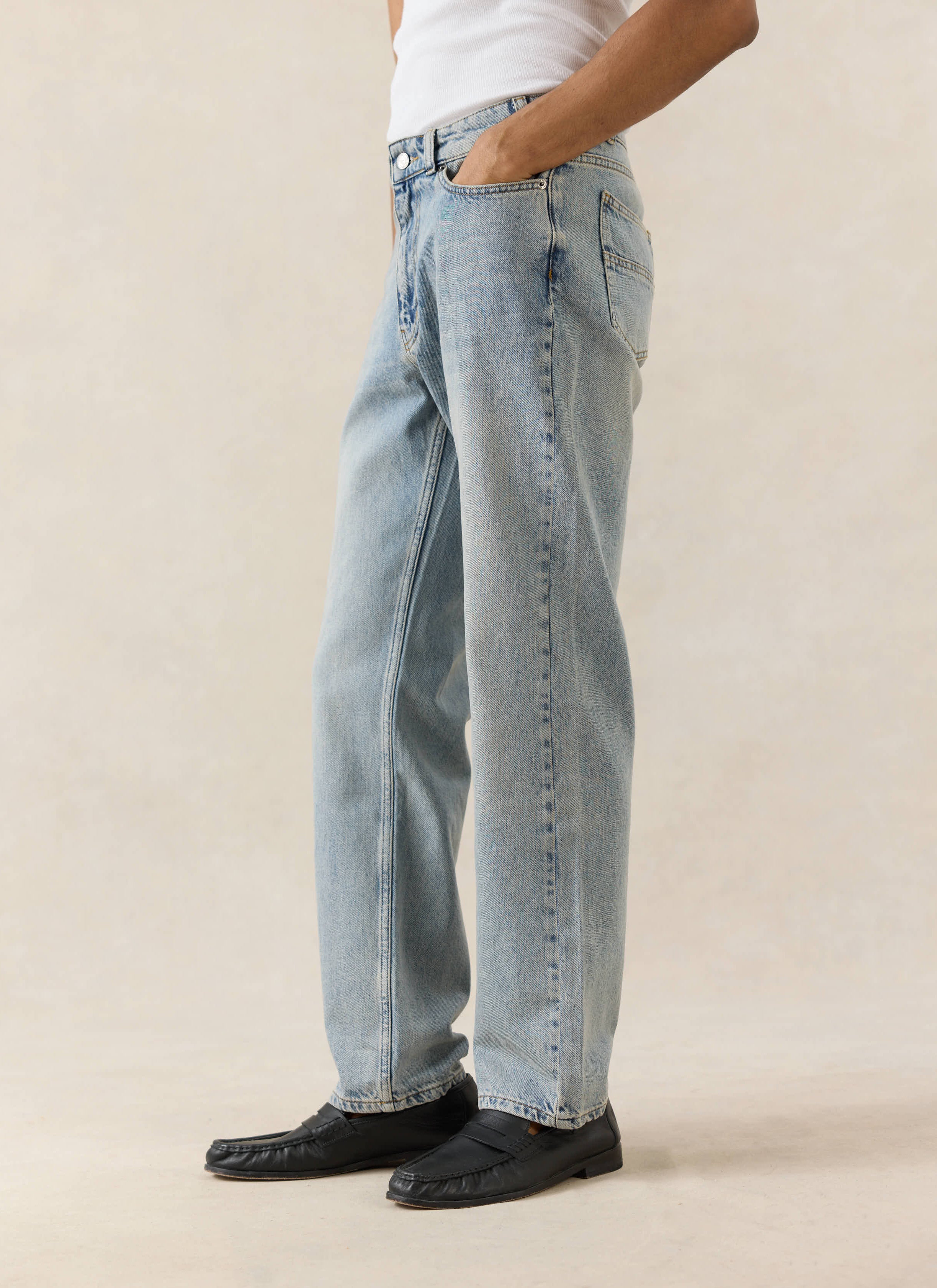 Percival straight leg denim jeans in stone wash, crafted from 12oz cotton and styled with black loafers.