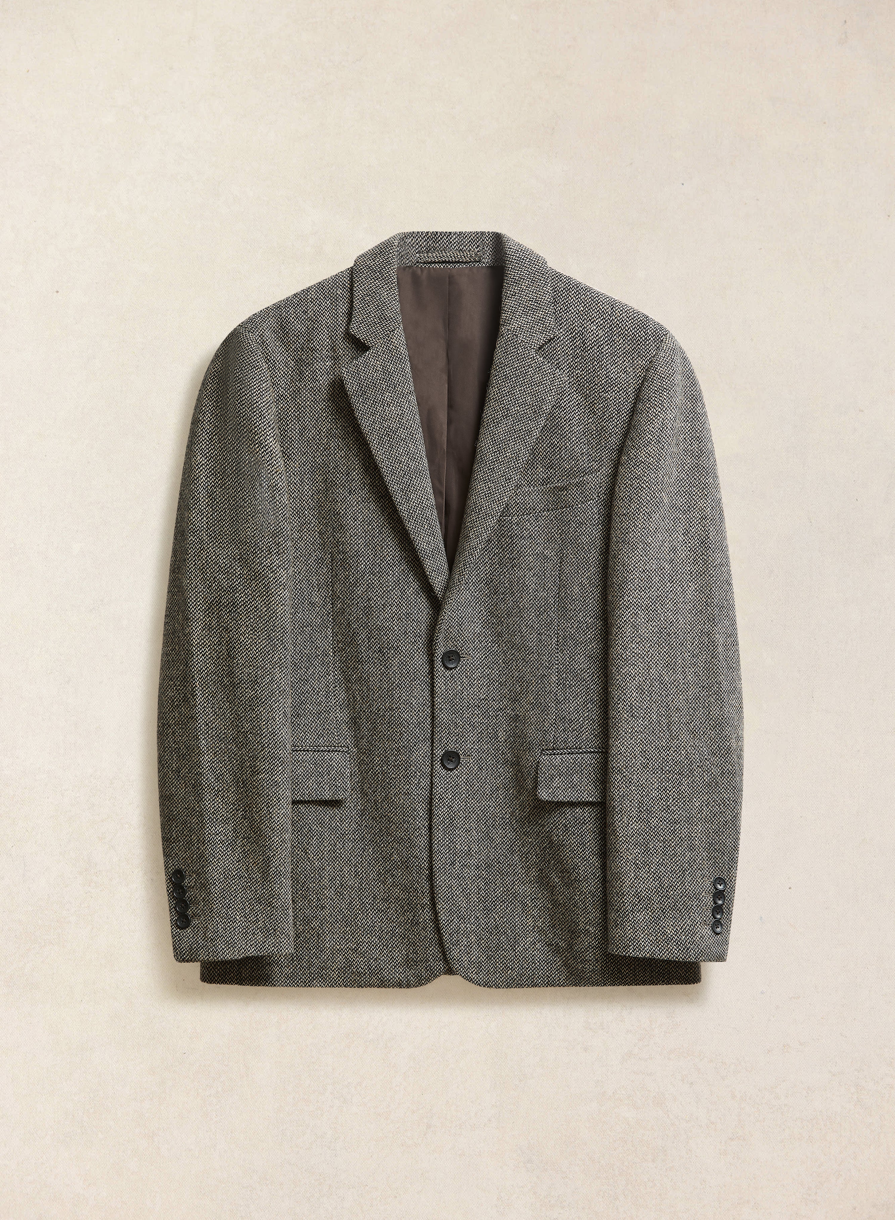 A Percival grey birdseye wool tailored blazer, featuring notch lapels and a two-button fastening.