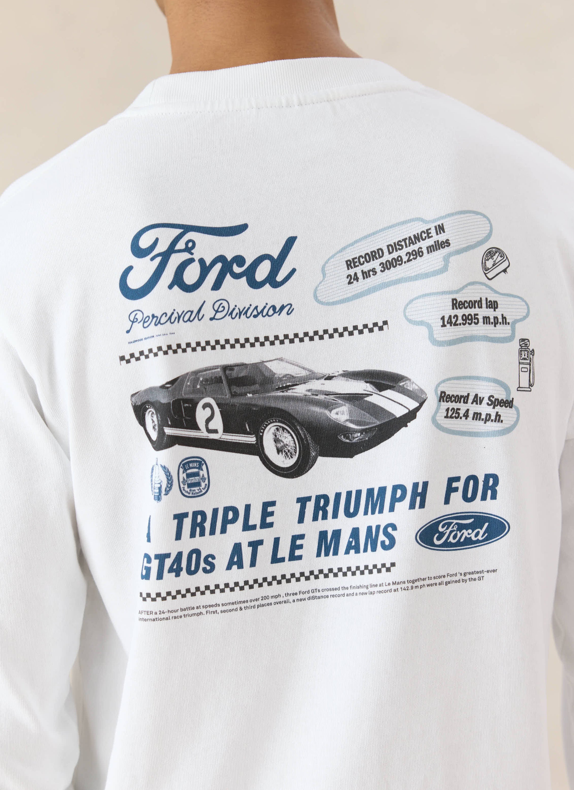 The white organic cotton Percival x Ford Triple Triumph long sleeve t-shirt features a vintage racing car back graphic.
